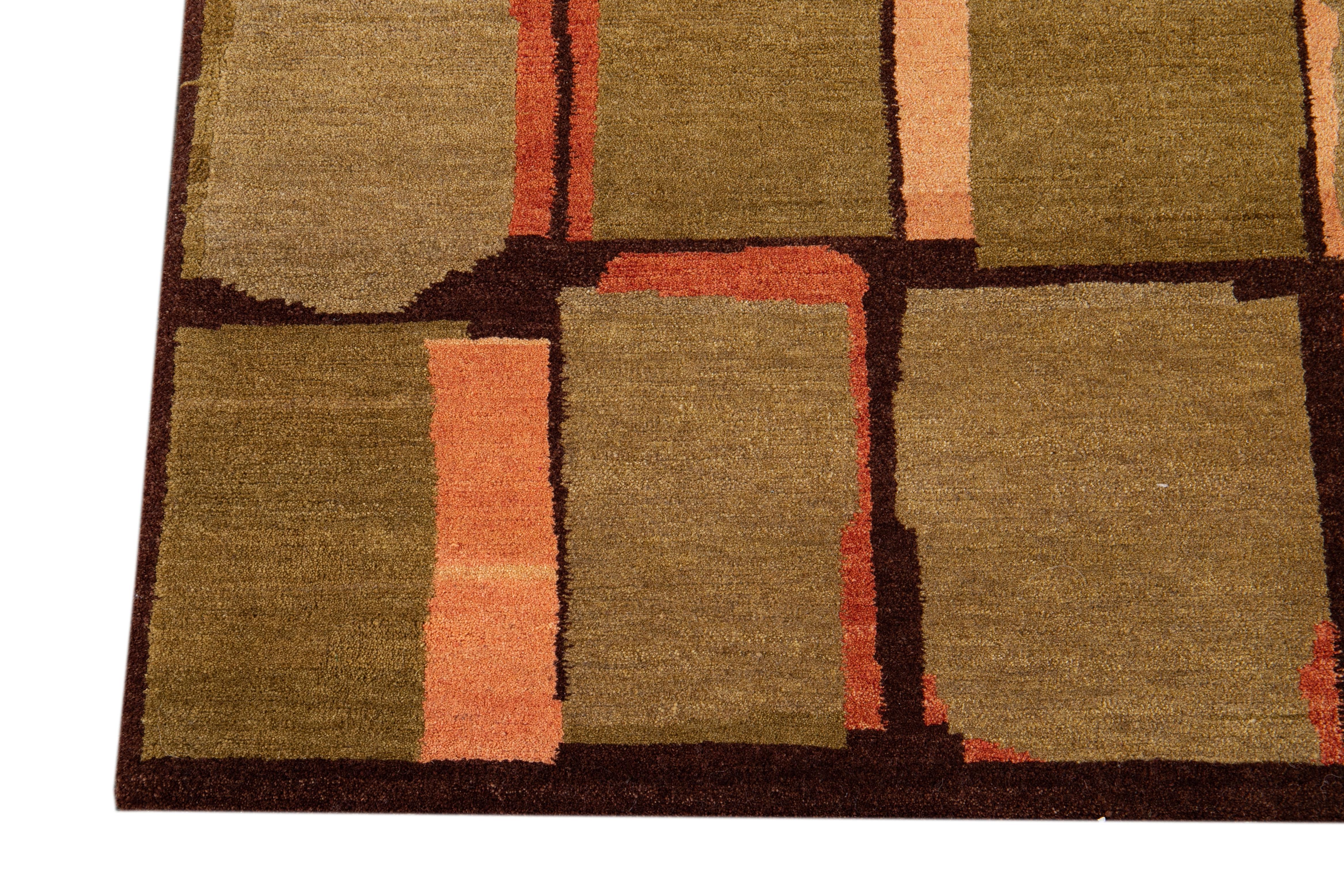 Contemporary Modern Wool & Silk Tibetan Rug with Geometric Design in Green & Orange For Sale