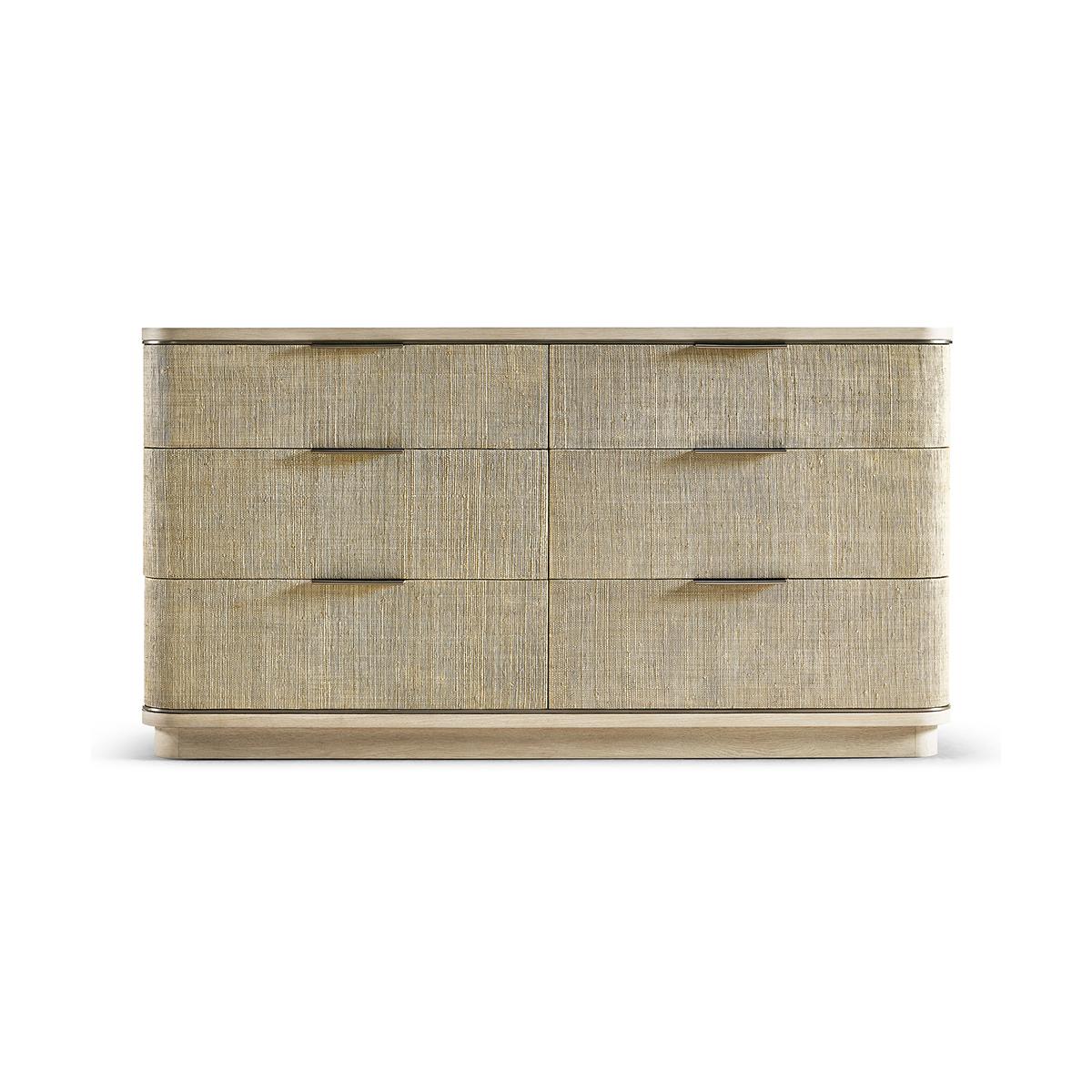 Modern woven double dresser, a beautifully crafted piece is born from passion and boasts incredible aesthetic details that are sure to take your breath away.

The dresser's six bleached oak drawers are wrapped in grasscloth, adding a subtle
