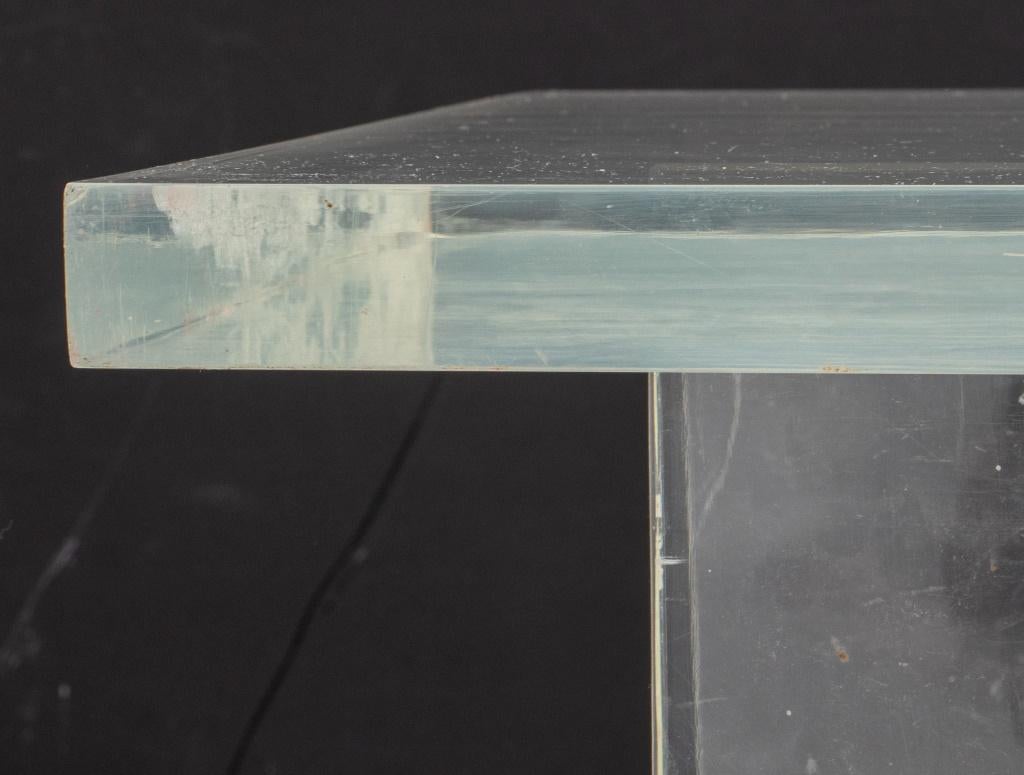 Modern X-Form Lucite Coffee Table, circa 1970s, the convex x-shaped stretcher supporting an elongated rectangular slab of lucite, apparently unsigned. 17