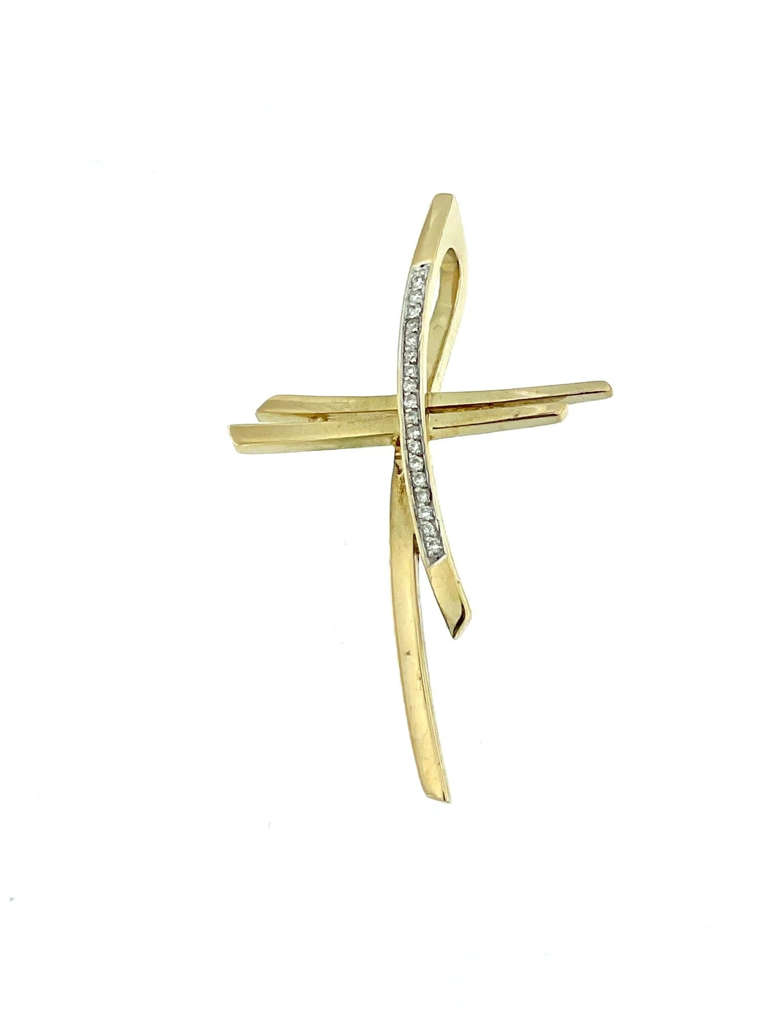 The Modern Yellow and White Gold Diamond Cross is an exquisite piece of jewelry crafted with precision and elegance. Made from 18kt gold, this cross combines the richness of yellow gold with the timeless appeal of white gold, creating a stunning