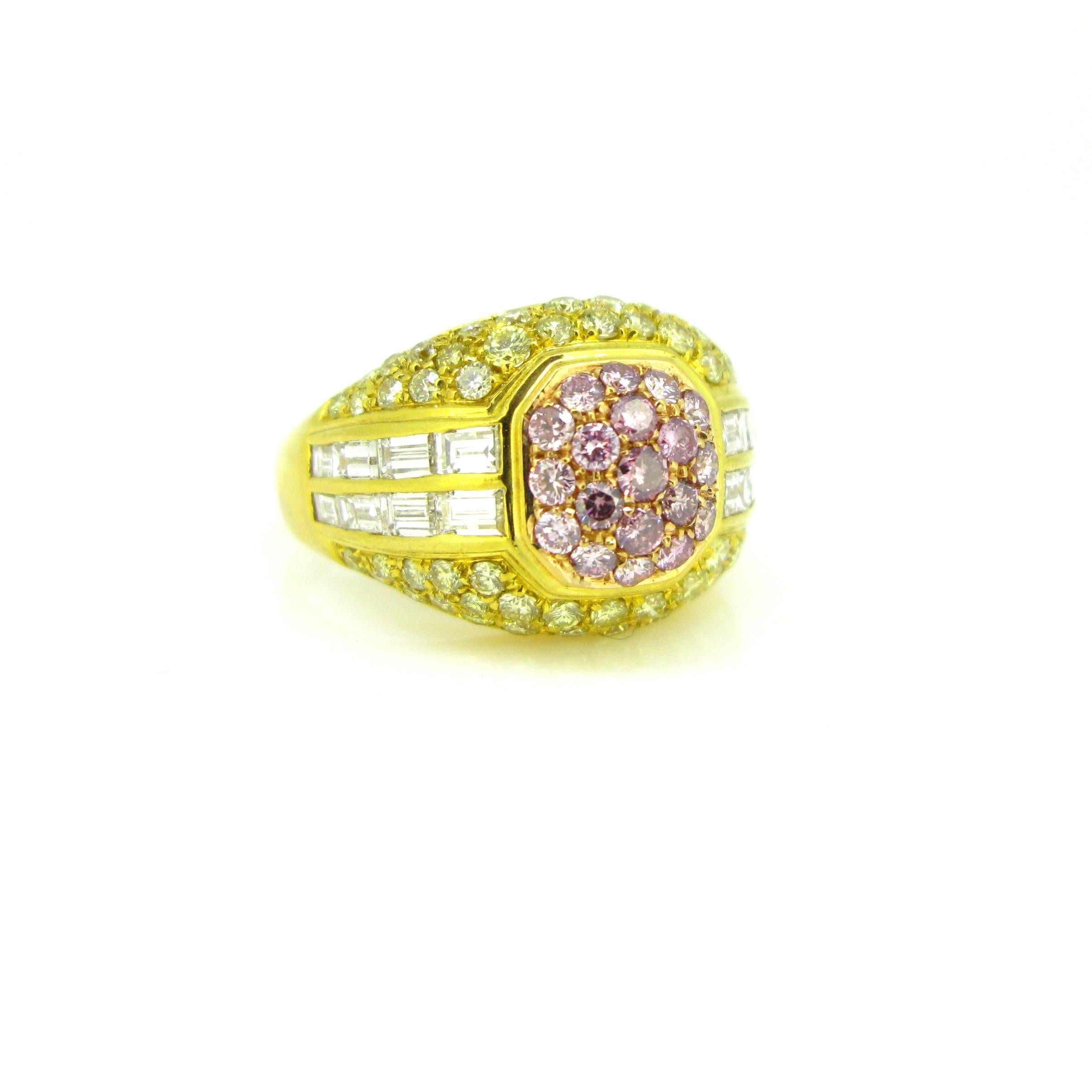 This new modern ring is made in 18kt yellow gold. It features 19 pink diamonds, 58 yellow diamonds and 16 tappers with a total carat weight of around 2.50ct. The coloured diamonds make the ring a really colourful and fun design. The centre features
