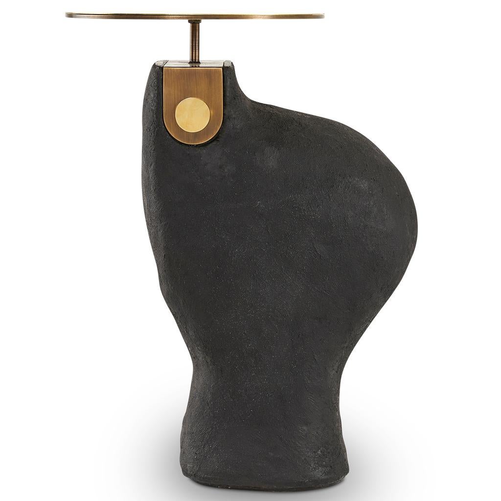 The modern Yoruba side tables are equally beautiful presented individually or as a side table nesting set. 
This large version has a hand finished black Yosemite plaster base. The solid polished brass top is connected to base with a bronzed steel