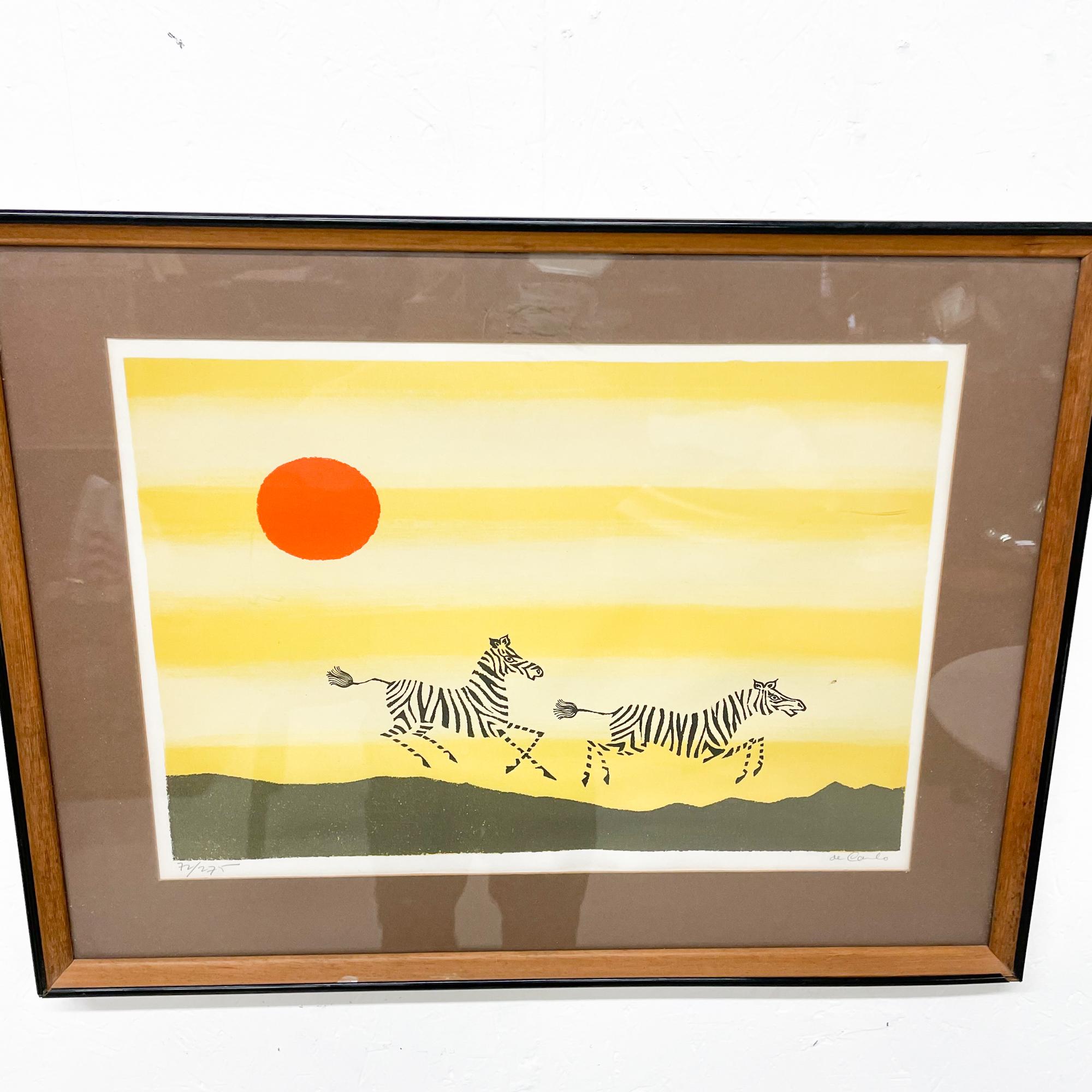 For your consideration a modern lithograph signed “ De Carlo”
Landscape with a Zebra and bright sun. Dominant color is yellow. 
Wood frame with plexiglass cover.
Original vintage unrestored. Wood frame has wear around the edge. 
Litho in good