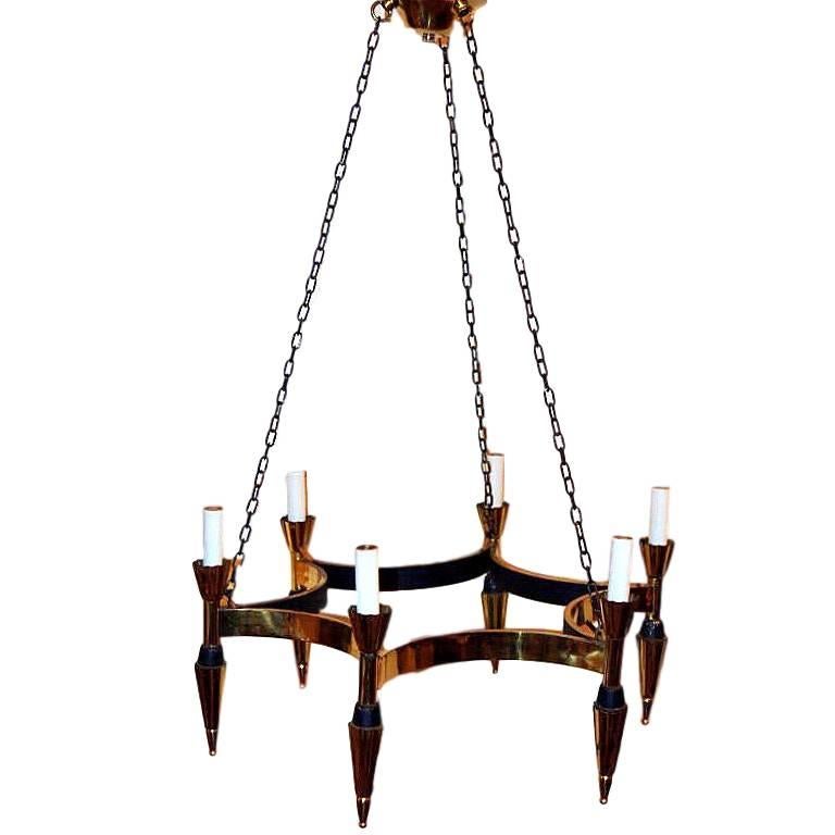 A French circa 1960's gilt brass moderne style 6-light chandelier with painted details.

Measurements:
Present drop: 24