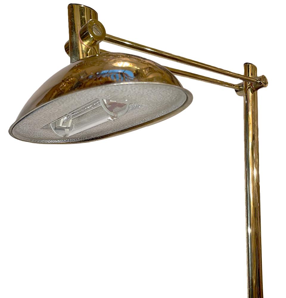 A circa 1960's Italian polished bronze floor lamp with adjustable shade and marble base.

Measurements:
Height:61.5