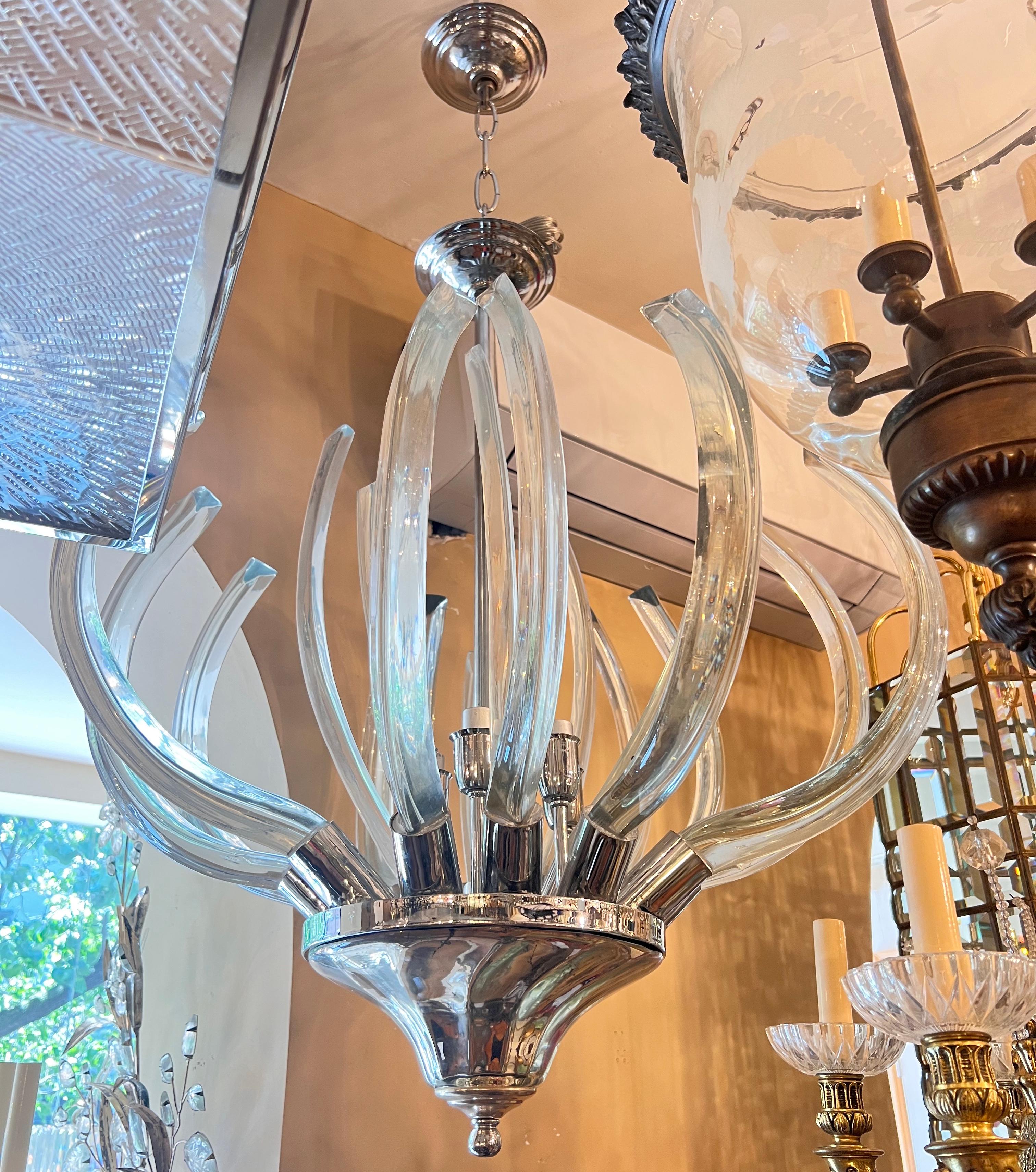 A circa 1960s Italian nickel plated and glass light fixture with 6 lights, mercury glass bottom body.

Measurements:
Diameter: 24.75