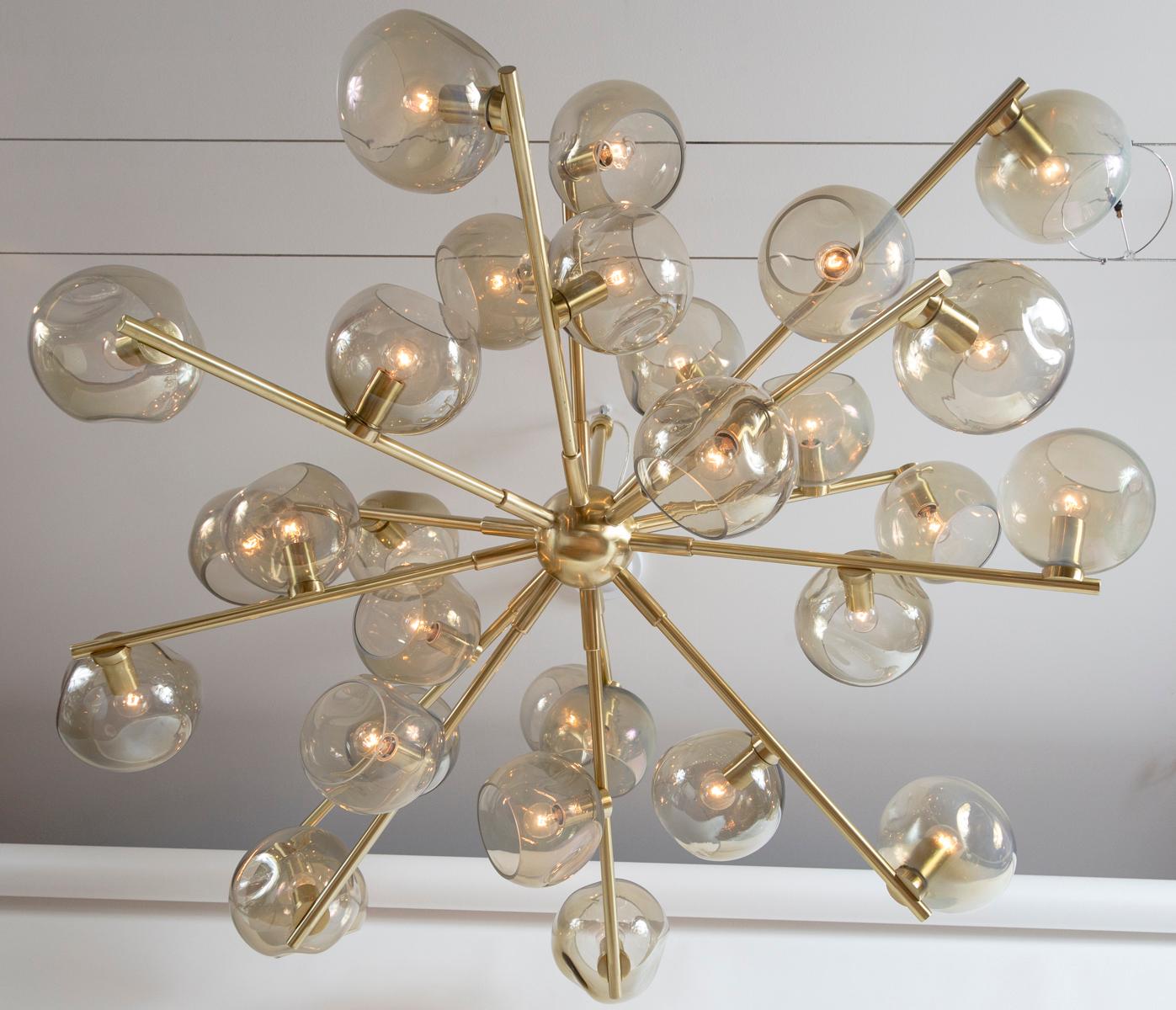 Large artisan modernist sputnik ceiling fixture with 14 finished brass arms holding 28 irregular smoke (grey-beige) iridescent blown glass globe lights
Handmade in Murano, Italy
sold as electrified for US (non-UL) and install ready with beautiful