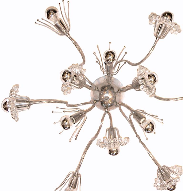 A circa 1960s French twelve-light nickel plated light fixture with crystal beads.

Measurements:
Diameter 30