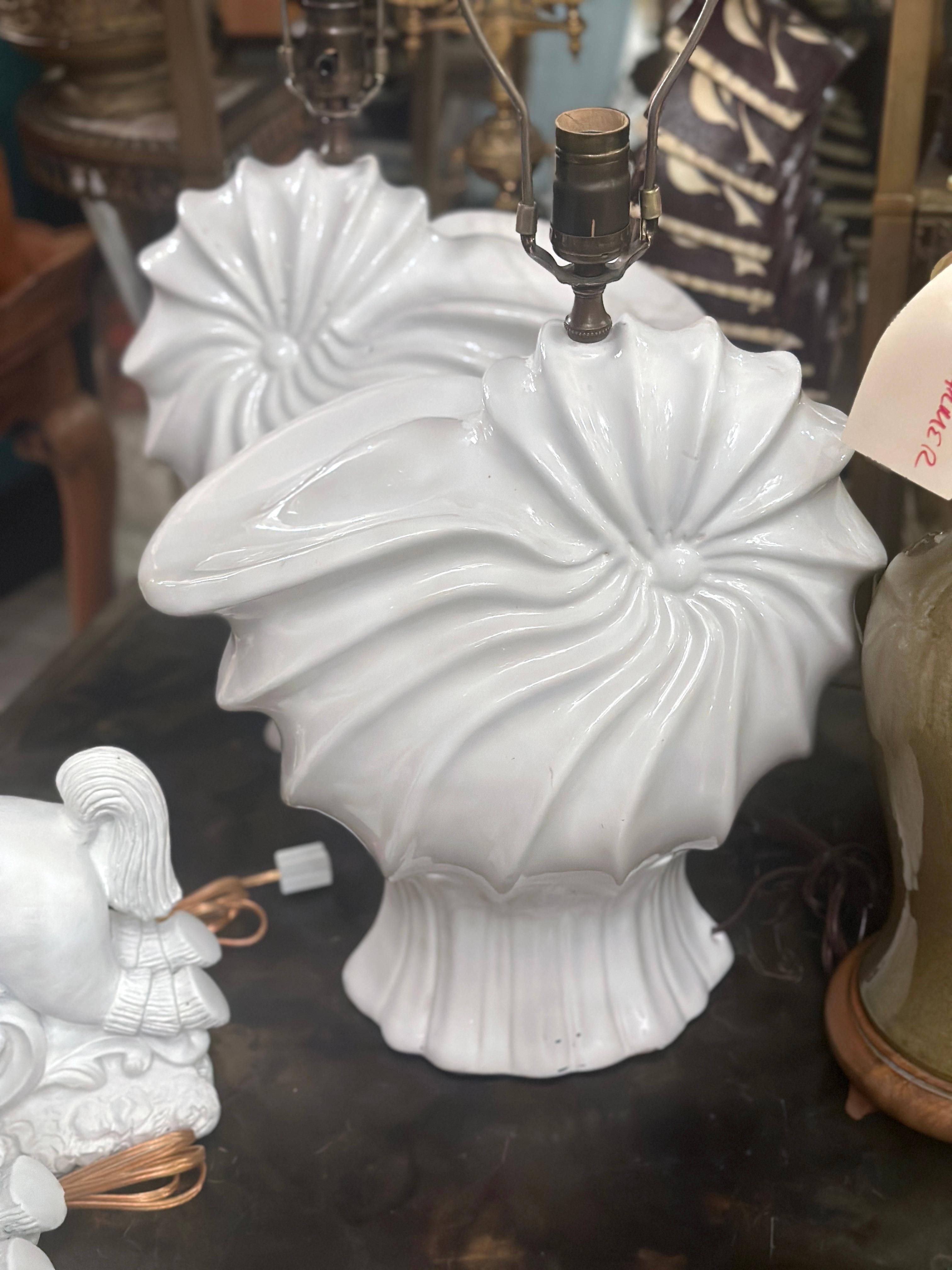 Pair of French circa 1940's shell shaped porcelain table lamps.

Measurements:
Height of body: 17