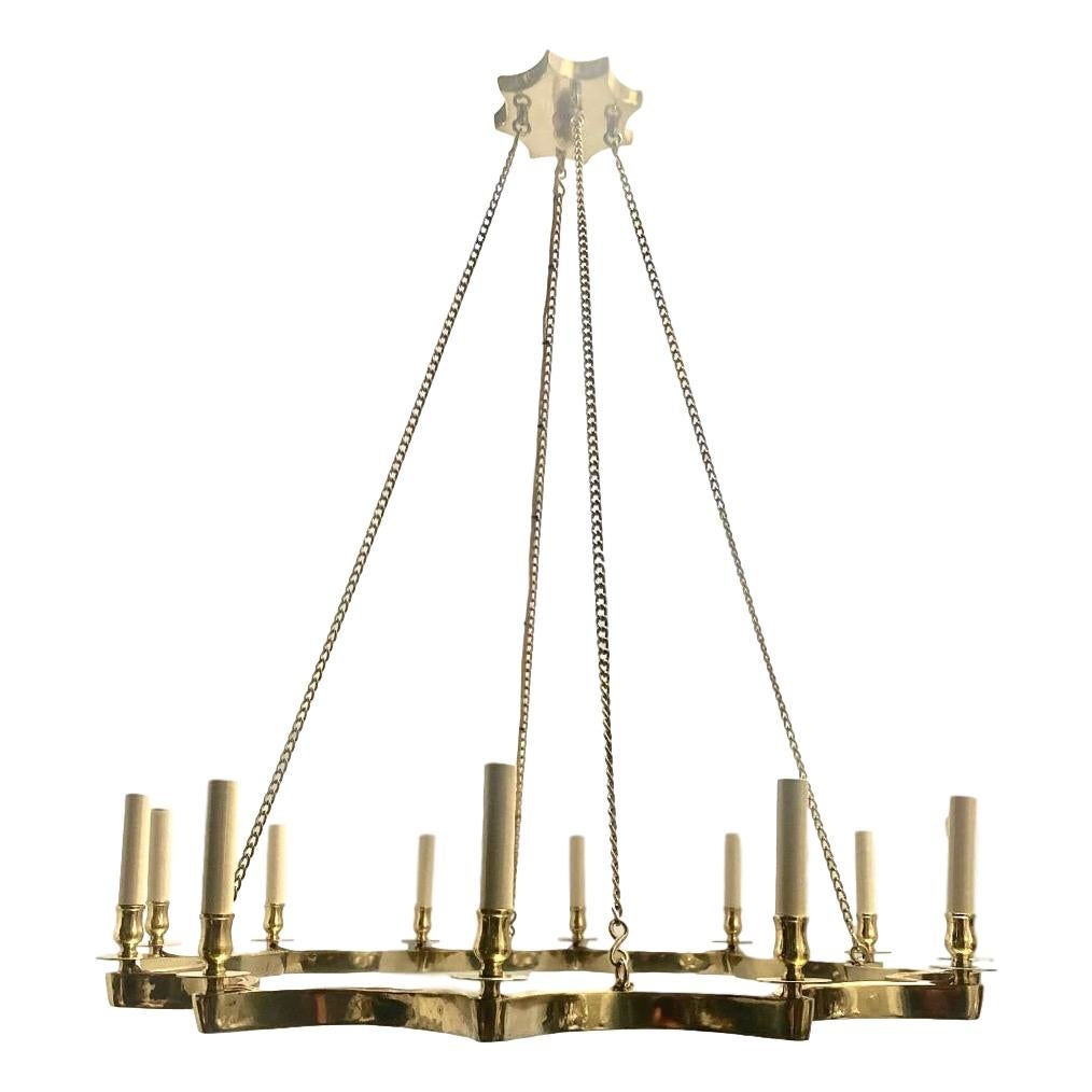A large circa 1960's French bronze star-shaped moderne 12-arm chandelier.

Measurements:
Present drop: 44