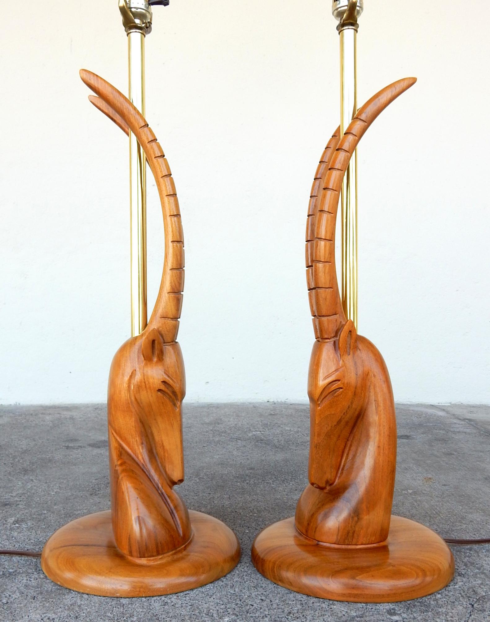 Magnificent moderne gazelle bust table lamps.
Skillfully sculpted in walnut.
Not signed or marked.
Both are in excellent condition with no damage, cracks or repairs.
These are large lamps. The gazelle are 22