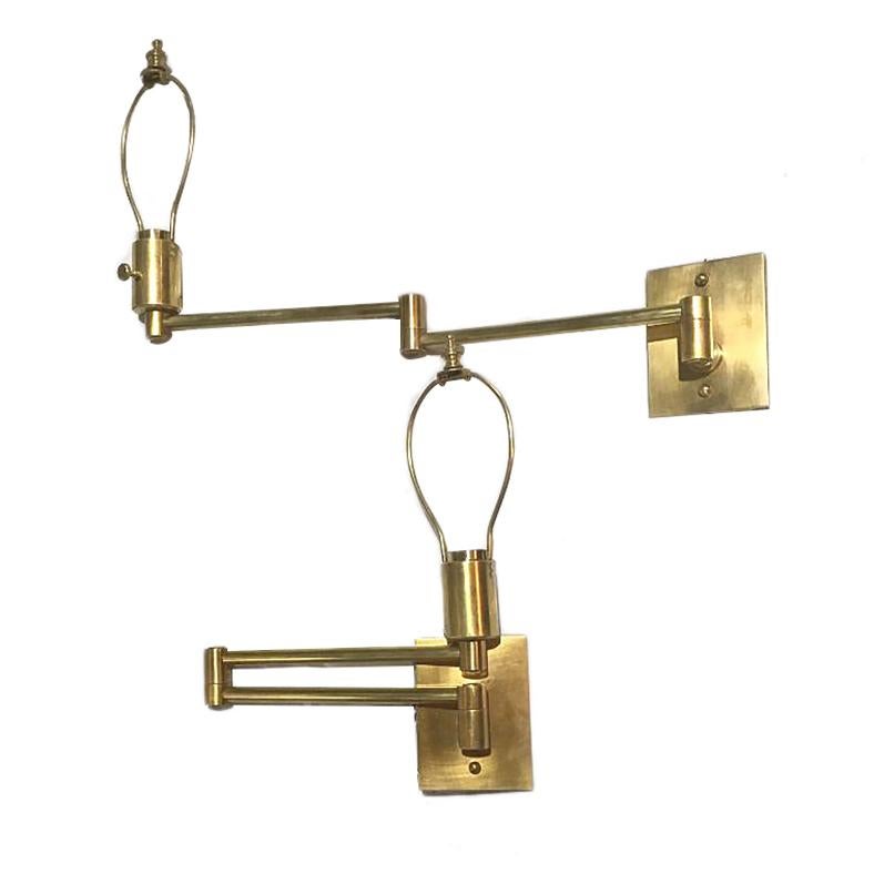 Pair of 1960's American brass swivel arm sconces with original patina.

Measurements:
Length (fully extended): 20
