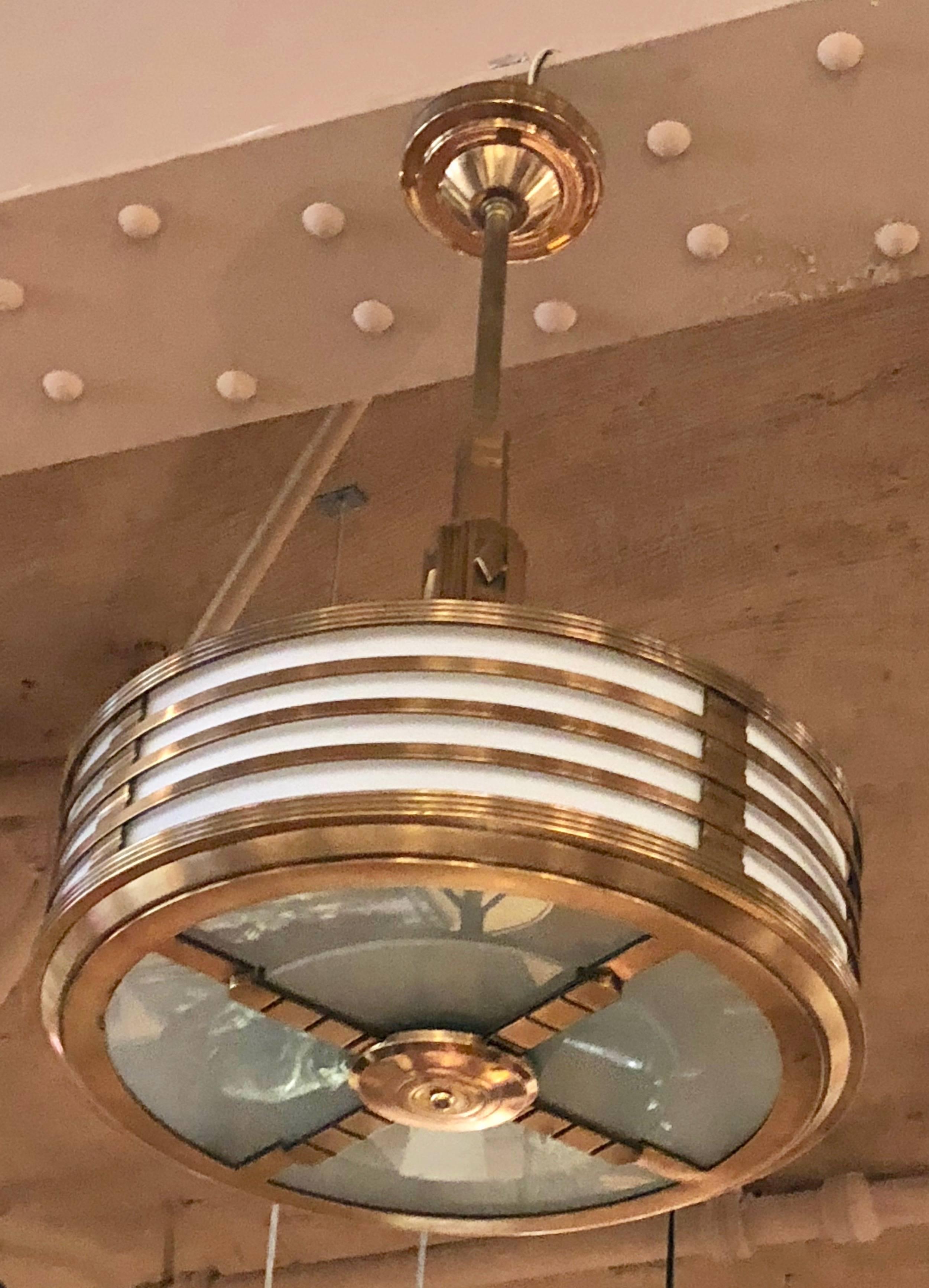 Spectacular Modernest Art Deco stepped copper bronze chandelier. Superior quality, metal work and finish. American made for use in movie theaters and office lobbies. There are two fixtures available two at 20? wide x 36? tall and one at 26? wide by