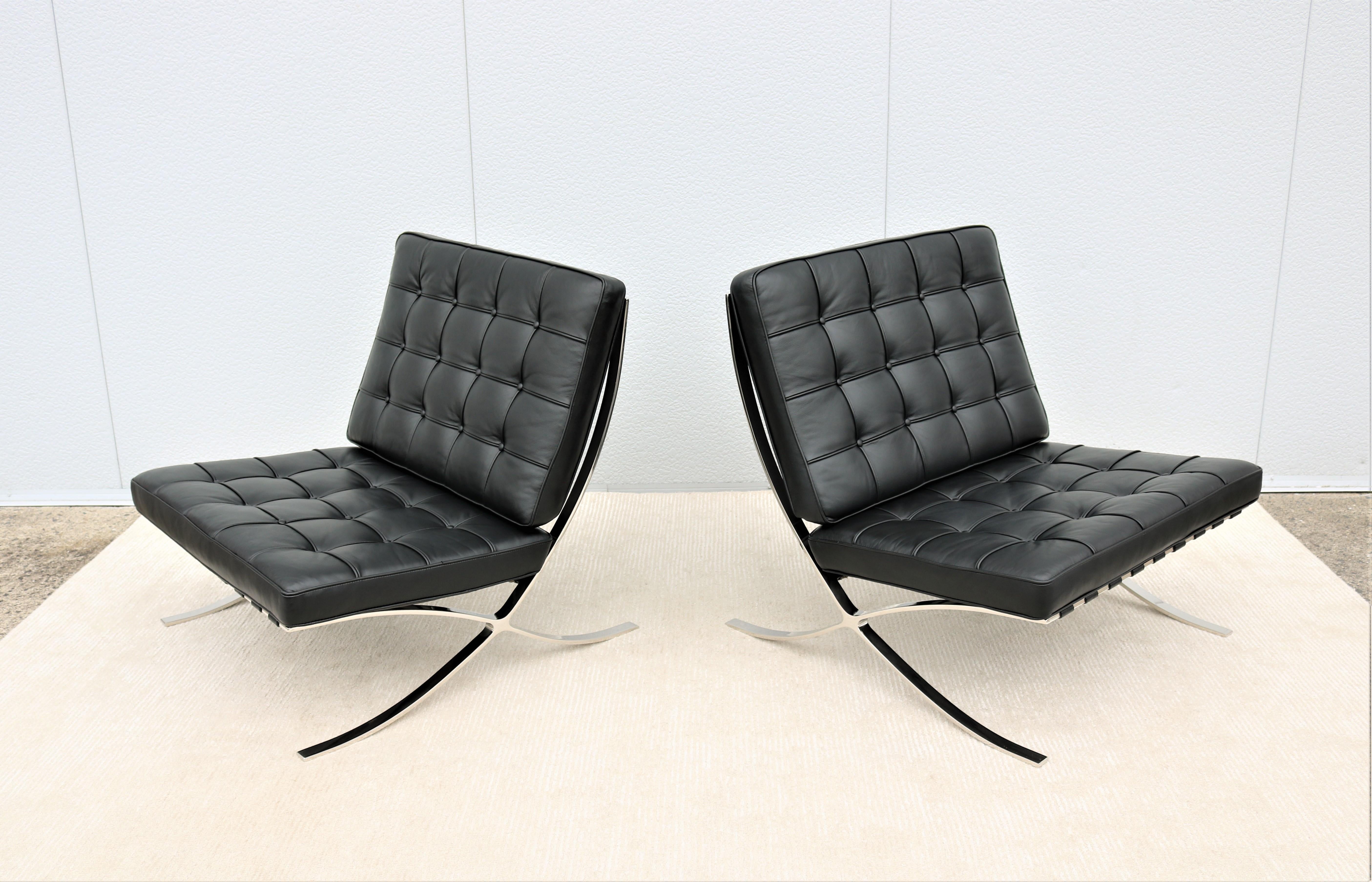 Fabulous pair of Barcelona chairs in black leather, feature highly desirable polished stainless-steel frames (notably more hand crafted than the chromed frame)
The classic Barcelona chair was exclusively designed by Mies van der Rohe for the German