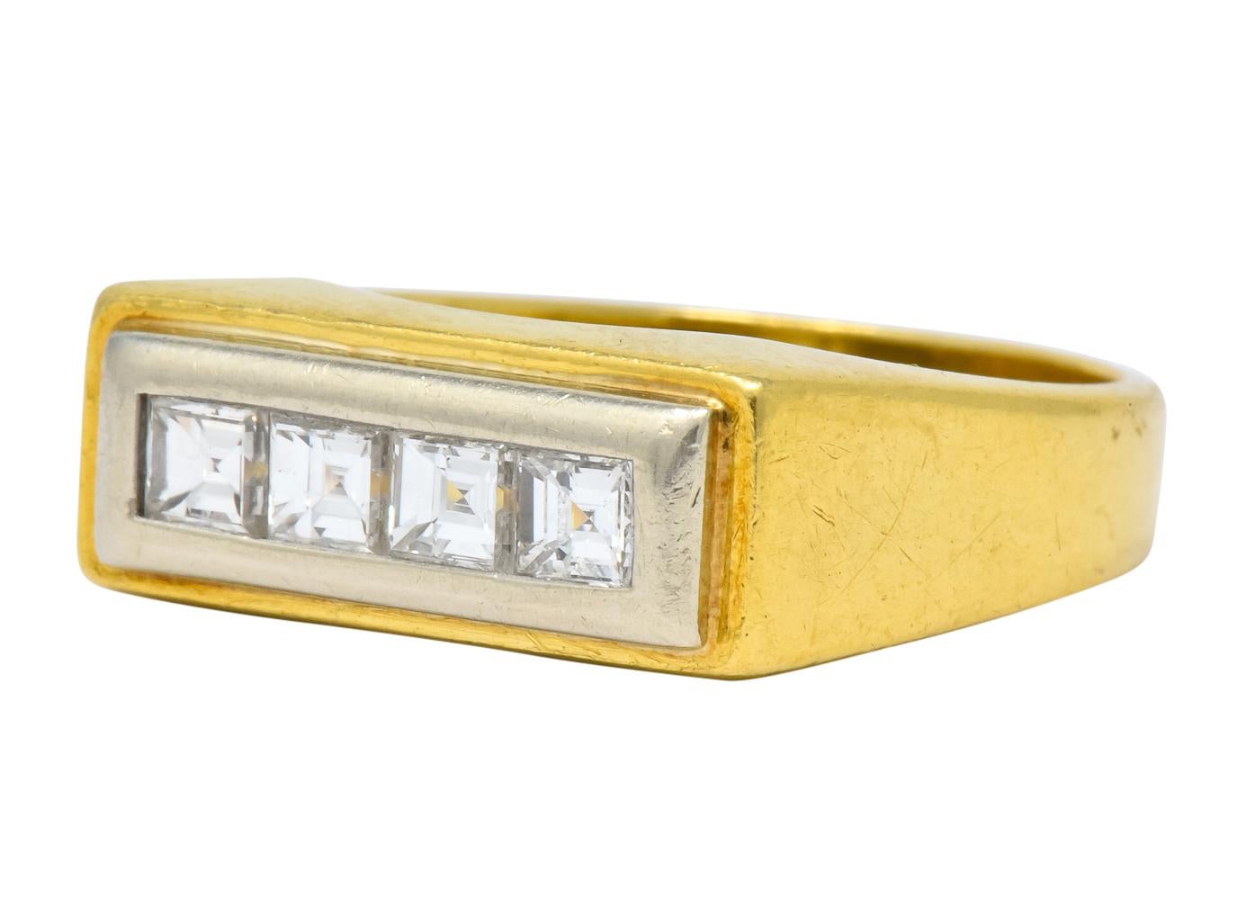 East to West rectangular band ring designed as platinum surrounded by gold

Channel set with four square step cut diamonds

Weighing in total approximately 0.72 carat with G/H color and 

Stamped 18K for 18 karat gold

Circa: 1970

Ring Size: 10 &
