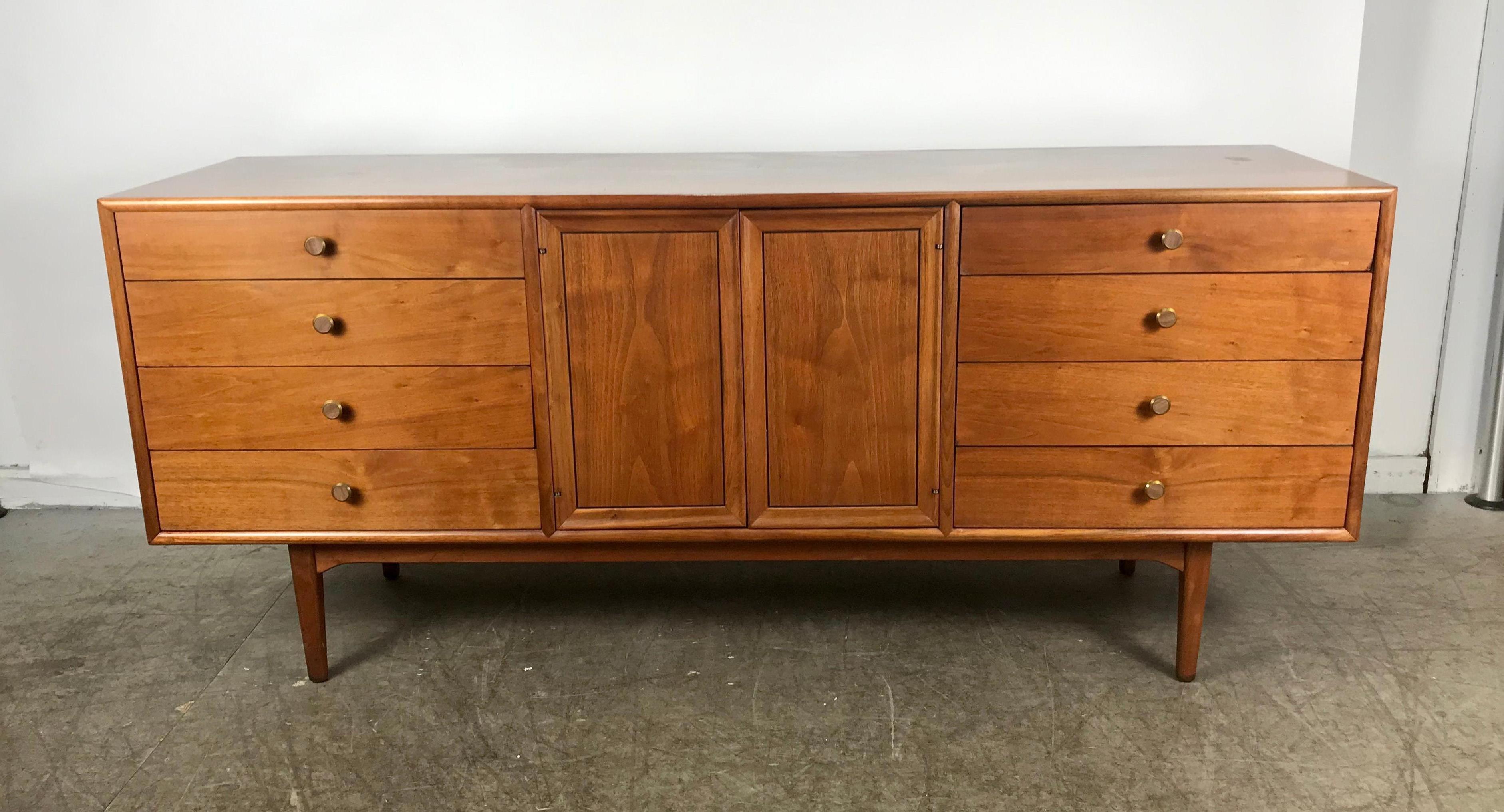 Modernist 11-drawer dresser by Kipp Stewart for Drexel, Classic Mid-Century Modern design, superior quality and construction, featuring 11 dove tail jointed drawers, brass hand pulls with inlay wood centers, hand delivery to New York City or