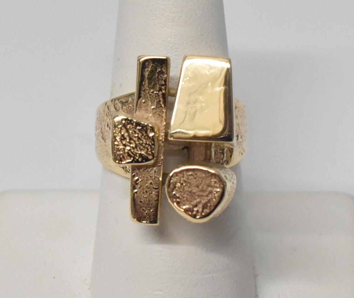14k yellow gold modern abstract design ring size 7.5. Polished and textured finish. 12.6 grams in weight. Attributed to Henri Leighton. 13/16