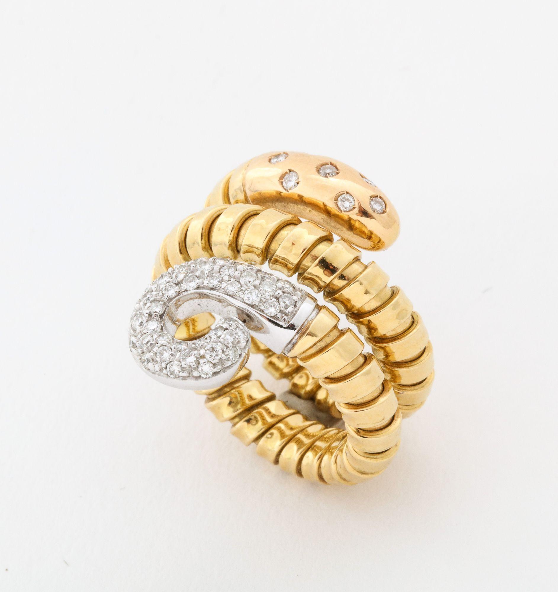 A flexible 18K Gold  Turbagas Snake Ring with a pave
