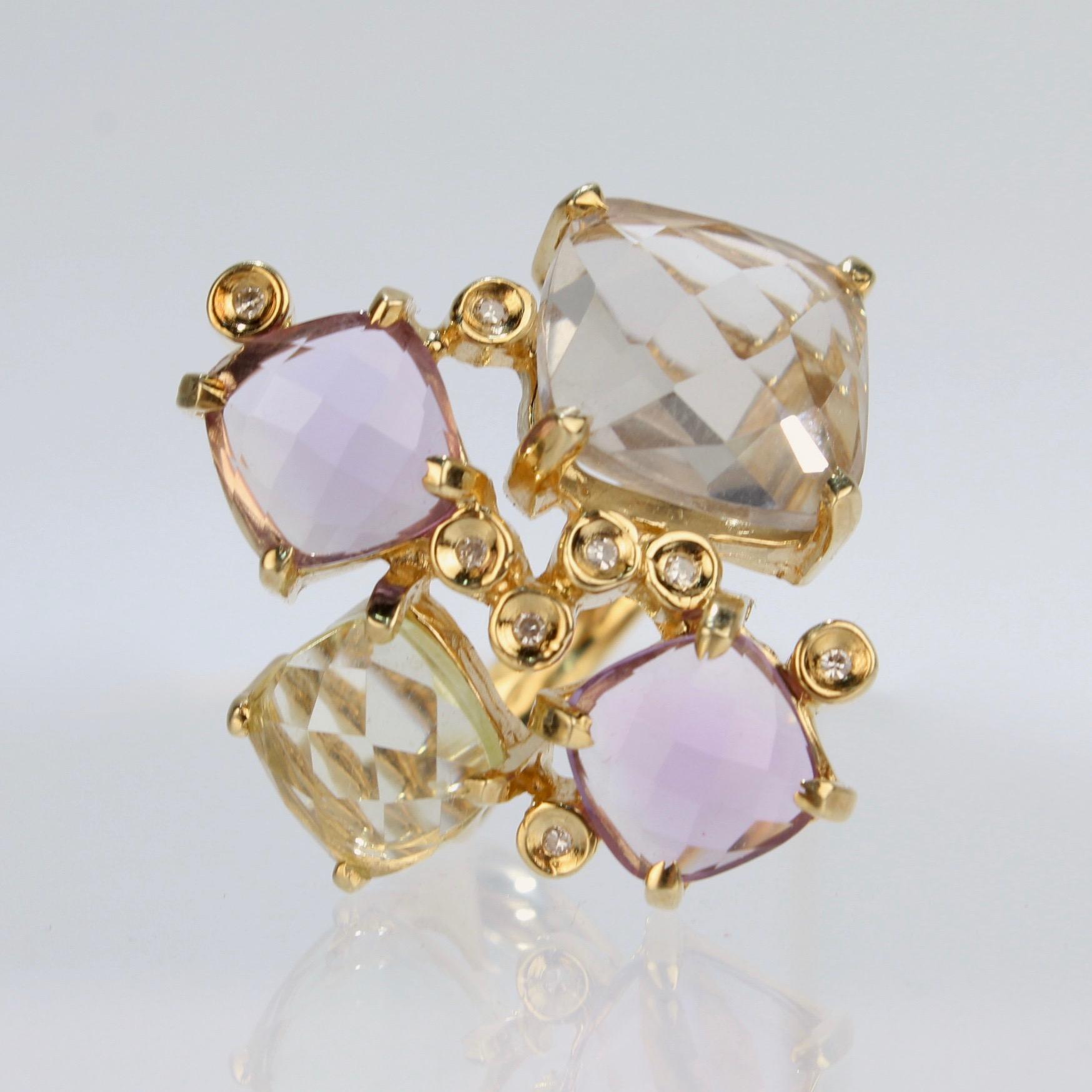 A wonderfully designed Modernist gemstone cluster cocktail ring in 18K gold.

With prong-set, faceted amethyst and citrine cabachon gemstones in varying shades that are interspersed with small, bezel set diamonds.

The stones are set in a convex arc