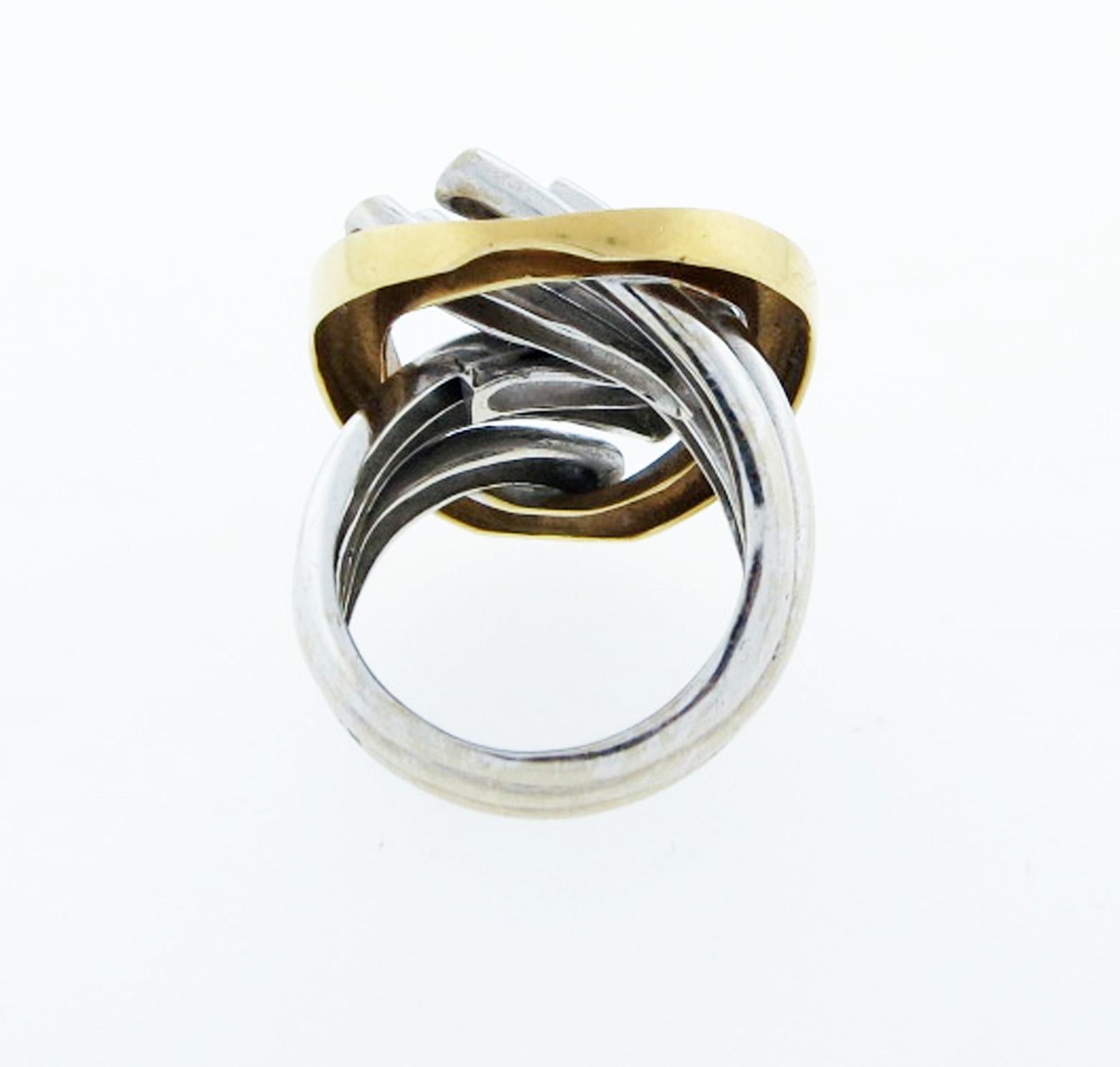 Bold  18kt. two finish two color ring in a strong 1960's design. Size 7 1/2 and can be sized. Marked 750 inside the shank.
