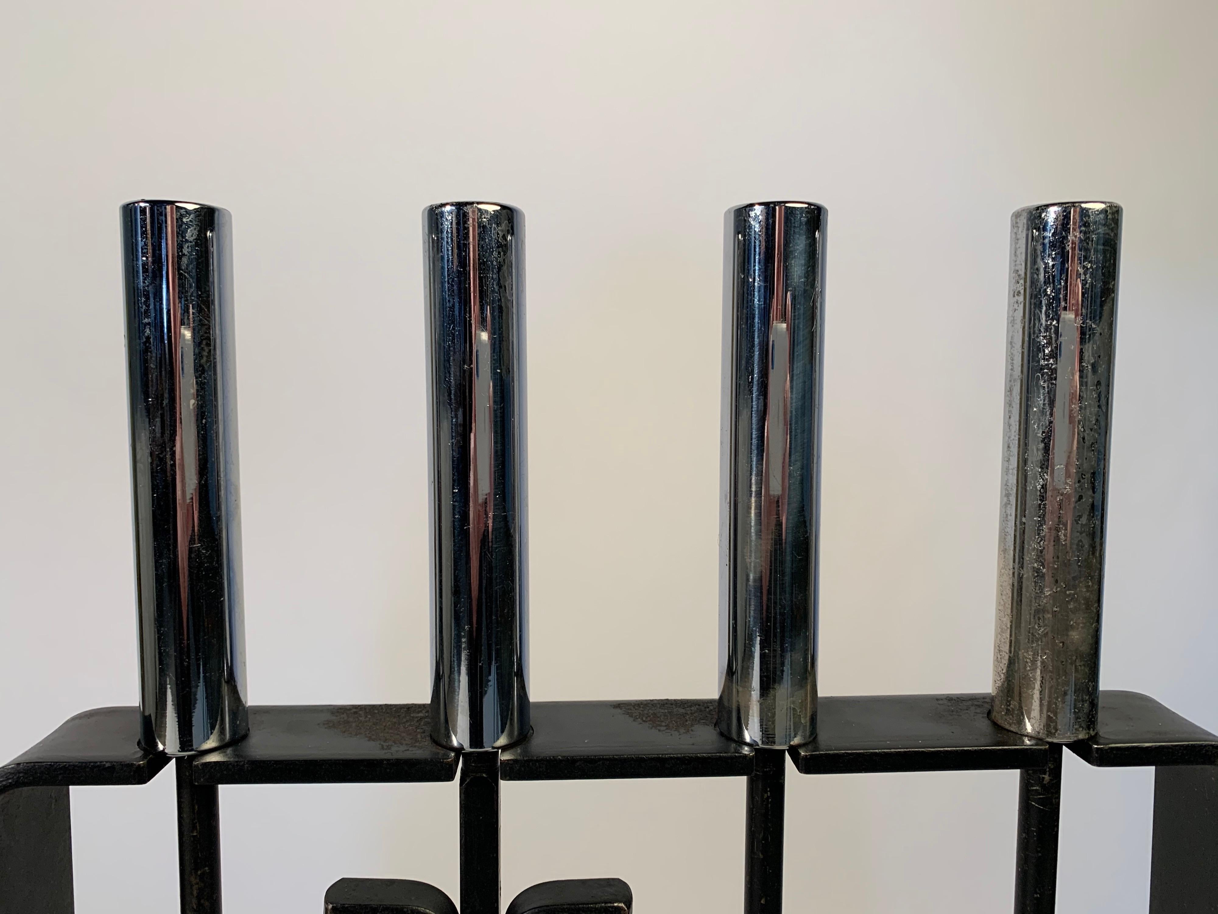 An attractive Mid-Century Modern iron fireplace tool set having solid chrome handles by Pilgrim,
circa 1950
In fabulous vintage condition having typical ware from usage.