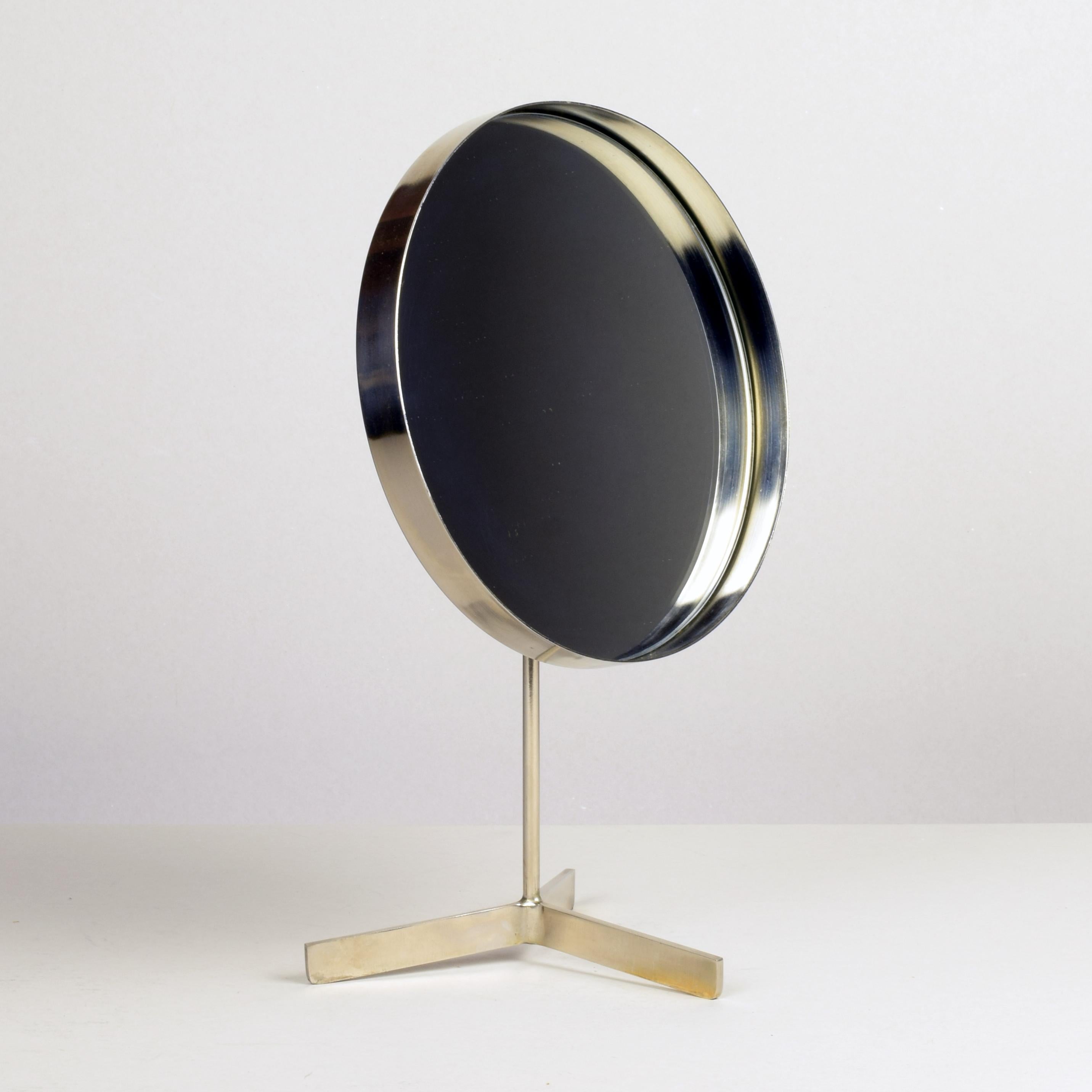 Robert Welsh (designer) attributed.
Durlston Designs Ltd (manufacturer)
A modernist vanity table mirror, circa 1960s.

Nickel-plated steel with mirrored glass insert. Adjustable.

Label to rear: Durlston Design Ltd, made in England - Hersham,