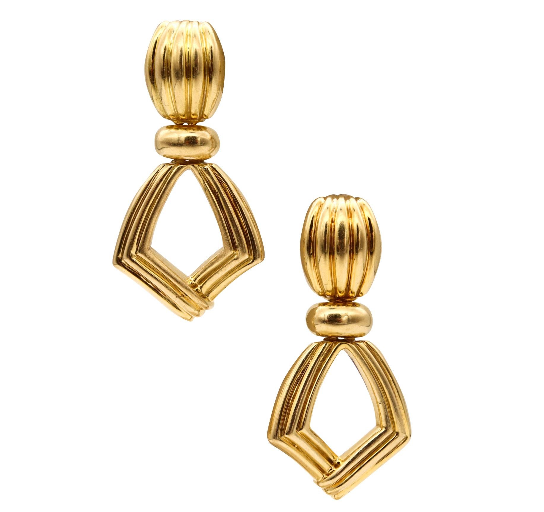 Fluted Door-Knockers drop earrings.

Very nice fluted pair, made with modernist fluted patterns, circa 1970. They was crafted in solid rich yellow gold of 18 karats and suited with posts (Removable) for pierced ears, and omega backs for fastening