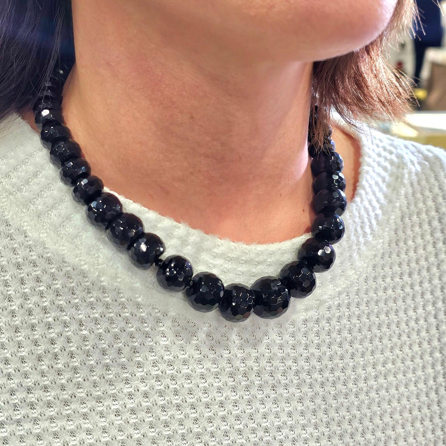 Modern necklace with graduated faceted beads.

Very elegant statement necklace, composed by graduated faceted beads of black onyx. Crafted with modernist look and fitted with a security push boxed lock made up in yellow gold of 14 karats.

Black