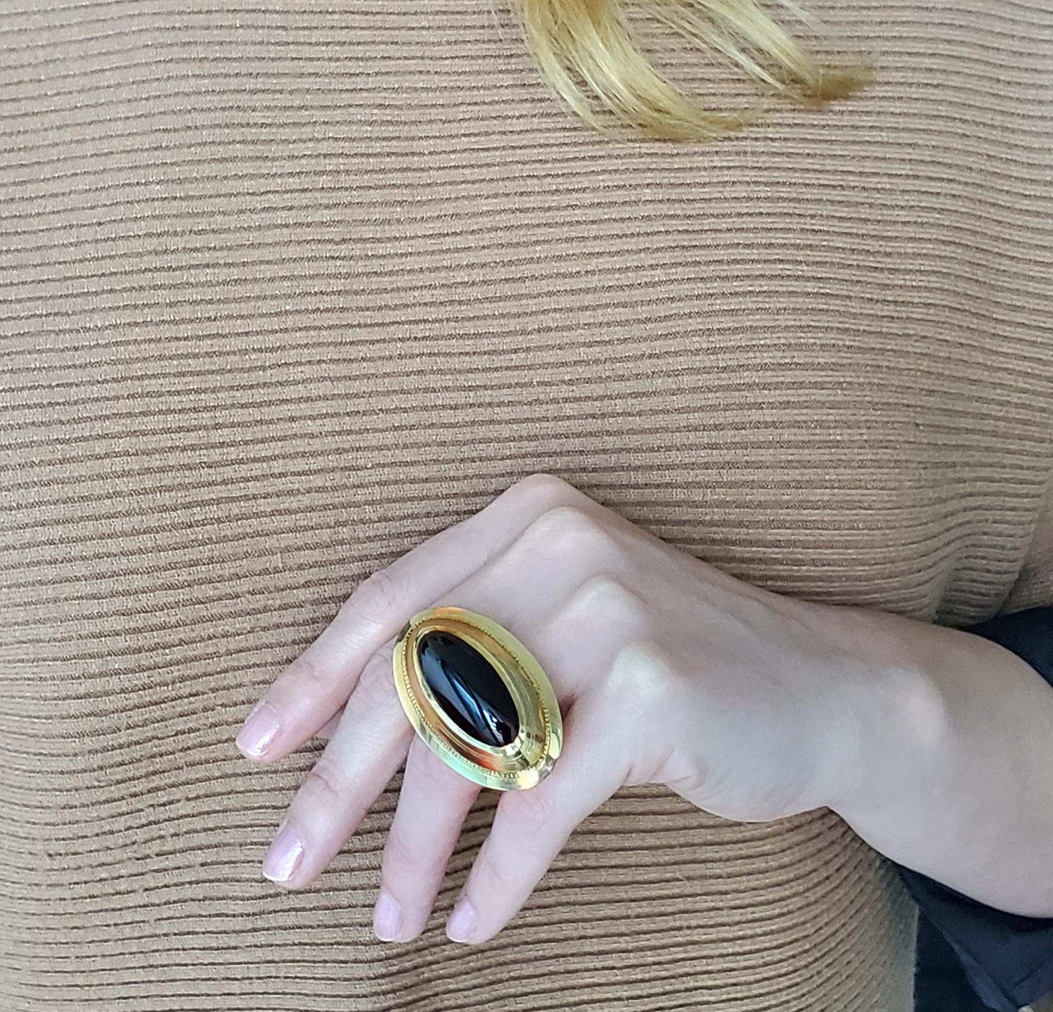 An statement sculptural cocktail ring.

Gorgeous oversized sculptural ring, crafted with a bold look in solid yellow gold of 18 karats with very high polished finish. This ring has been manufactured with a massive appearance that stands out in the