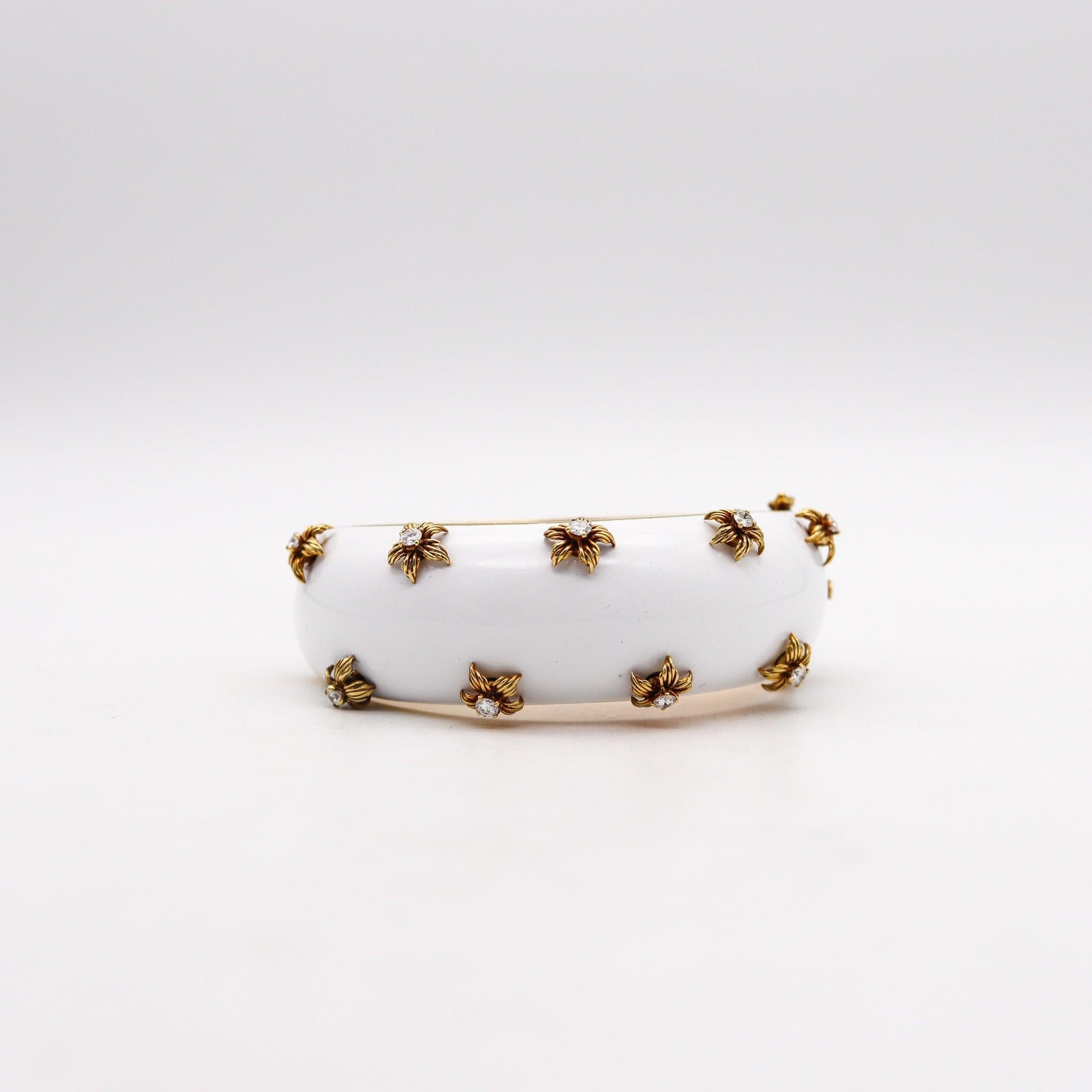 An Italian modernist bangle bracelet with white enamel.

This is a fabulous bangle bracelet, created in Italy during the modernist period back in the 1970. The bracelet has been crafted in solid yellow gold of 18 karats and decorated with nine