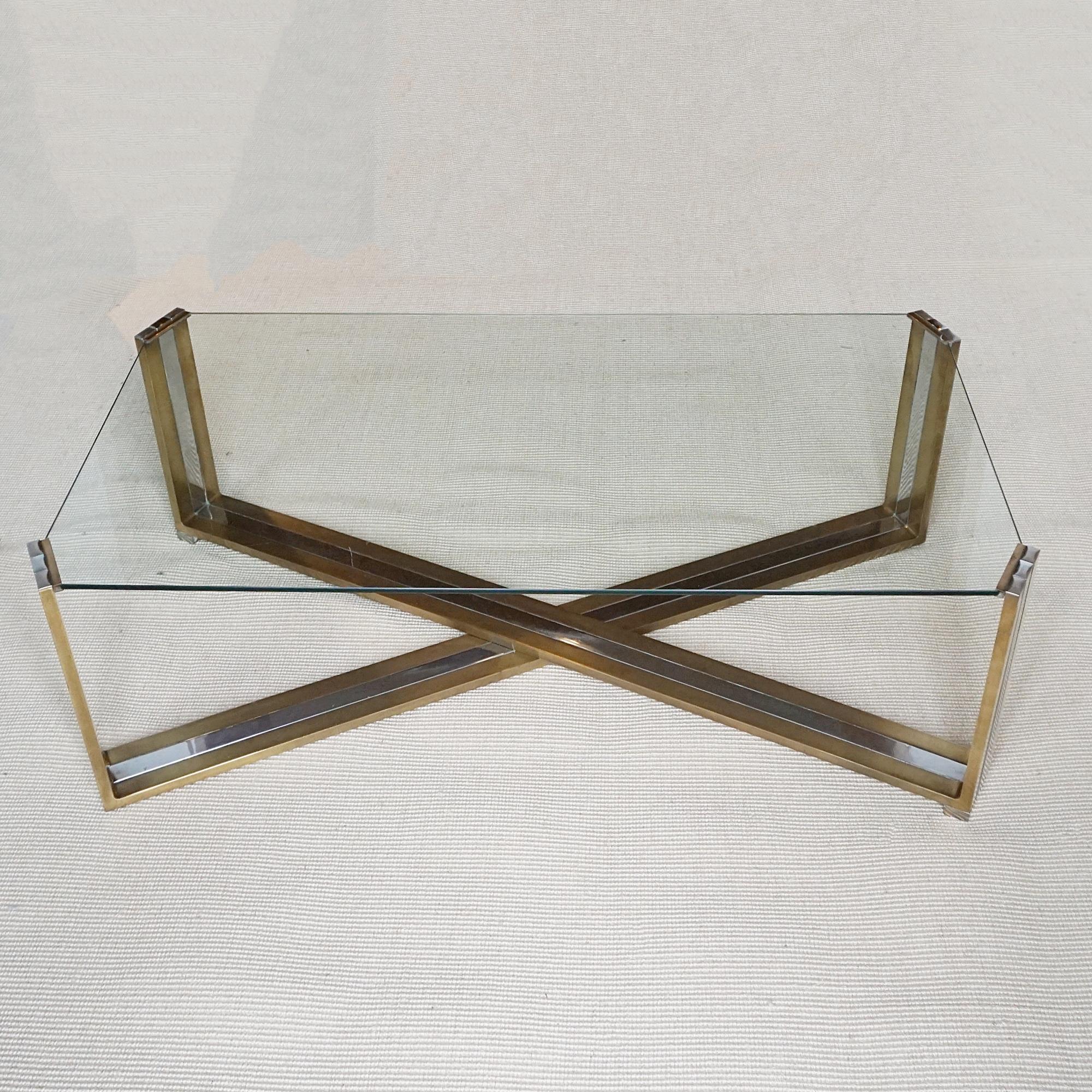 A Mid-Century coffee table designed by Romeo Rega. Brass and chrome X-frame base with inset glass top. 

Dimensions: H 35.5cm W 110cm D 60cm

Origin: Italian

Date: Circa 1970

Item Number: 1704241

Romeo Rega (1925–1981) was an emblematic figure in