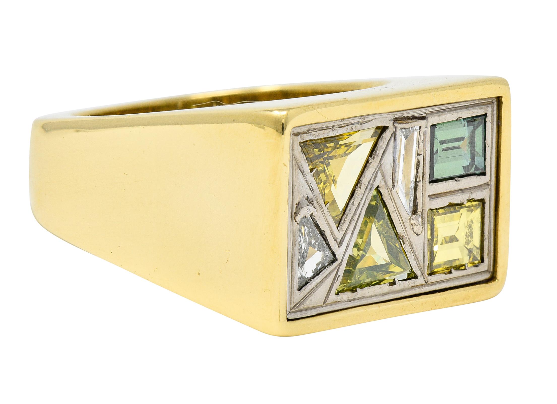 Featuring baguette, trilliant, and trapezoid cut diamonds flush set in recessed white gold panel. Fancy colored light blue, light yellow, greenish blue, greenish yellow, medium yellow, and white. Weighing approximately 2.84 carats total with VS