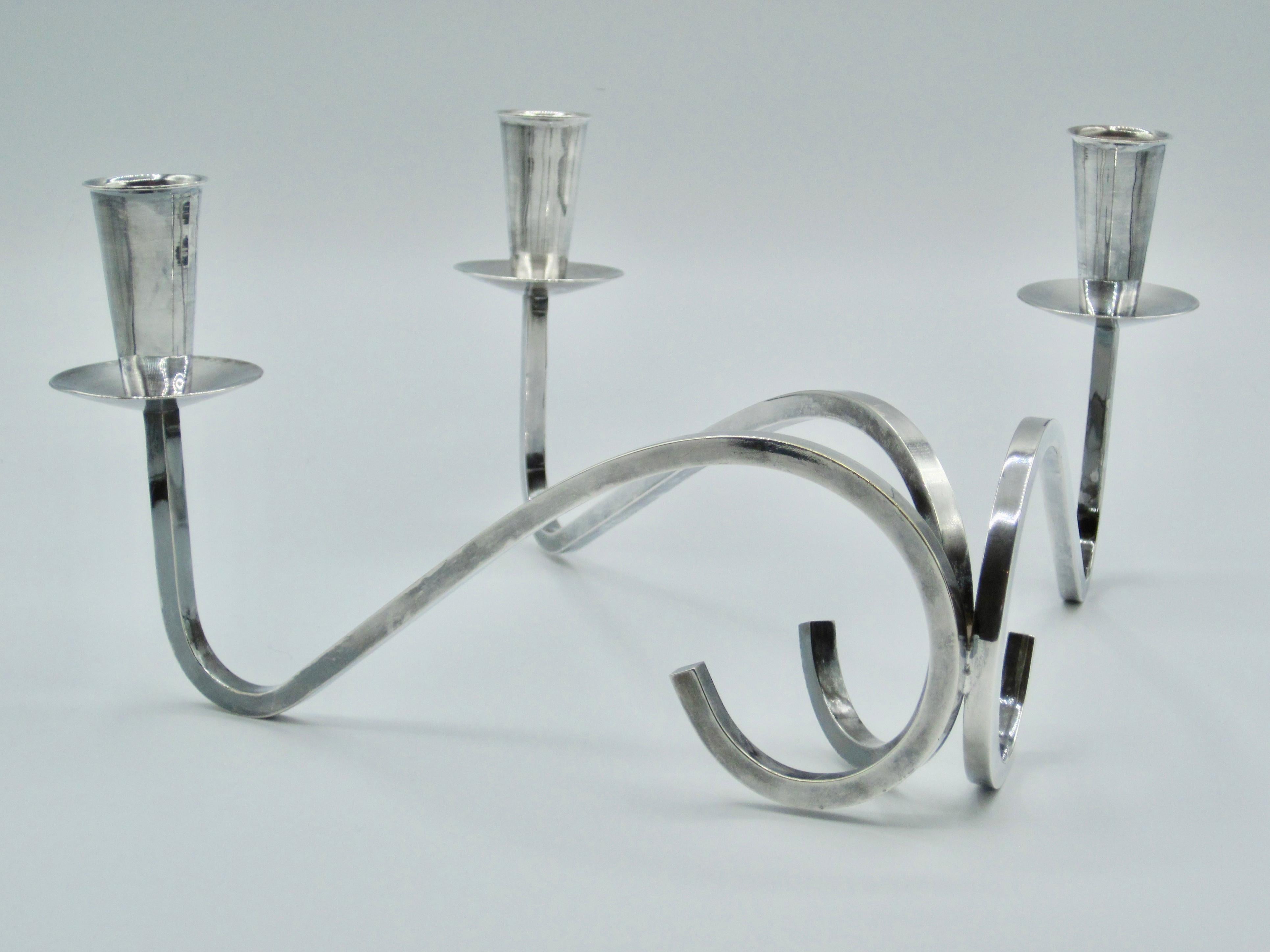 Modern Fisher Silversmiths curvilinear 3 arm candelabra. Impressed with manufacturer's mark to underside. c.1960s Perfect for a low table scape.
Good condition.