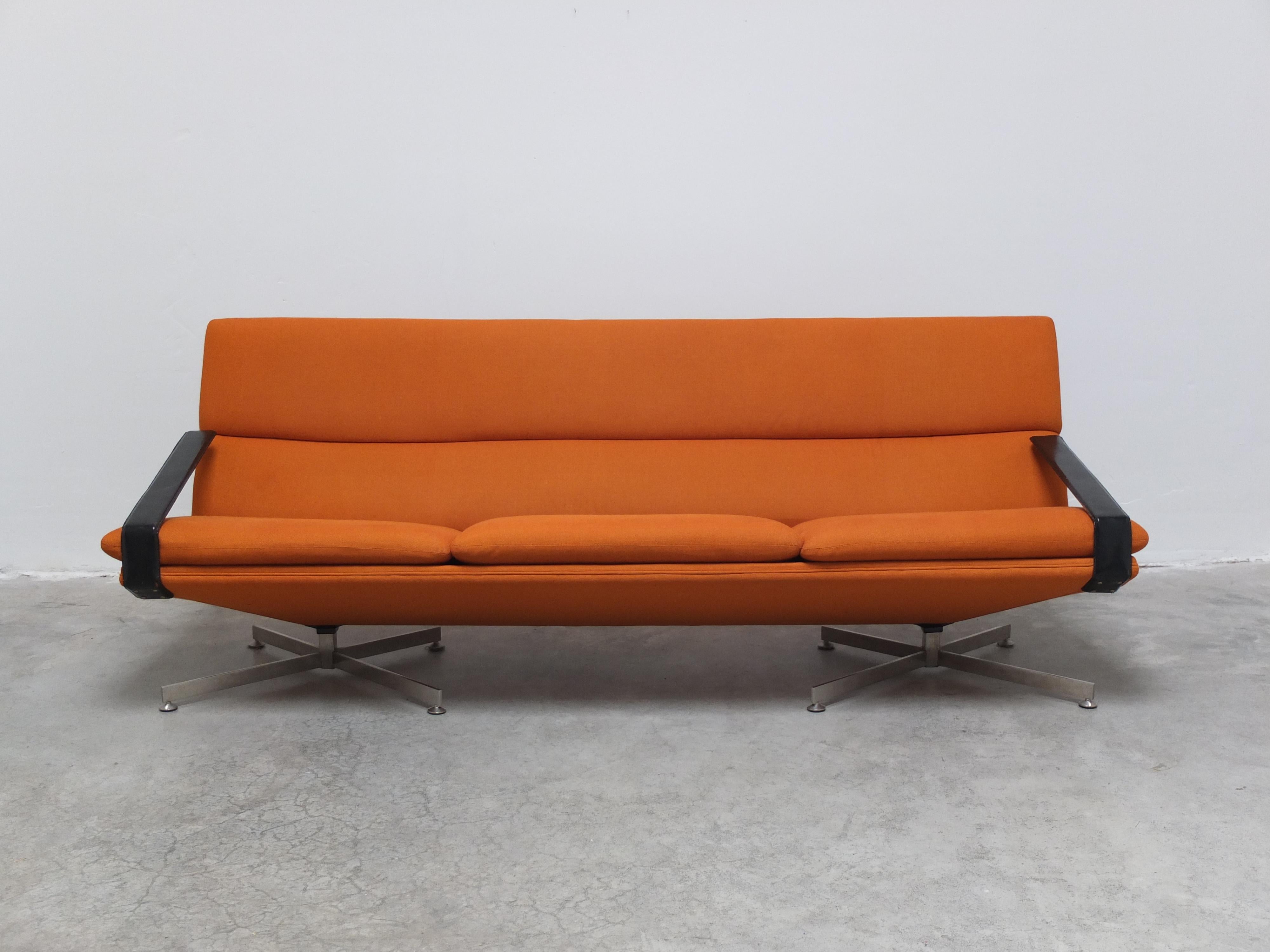A rare modernist 3-seater sofa designed by Georges Van Rijck for Beaufort during the 1960s. It has a double metal star-shaped base that is also found on the separate lounge chairs. Particular on this example are the armrests which I have not seen
