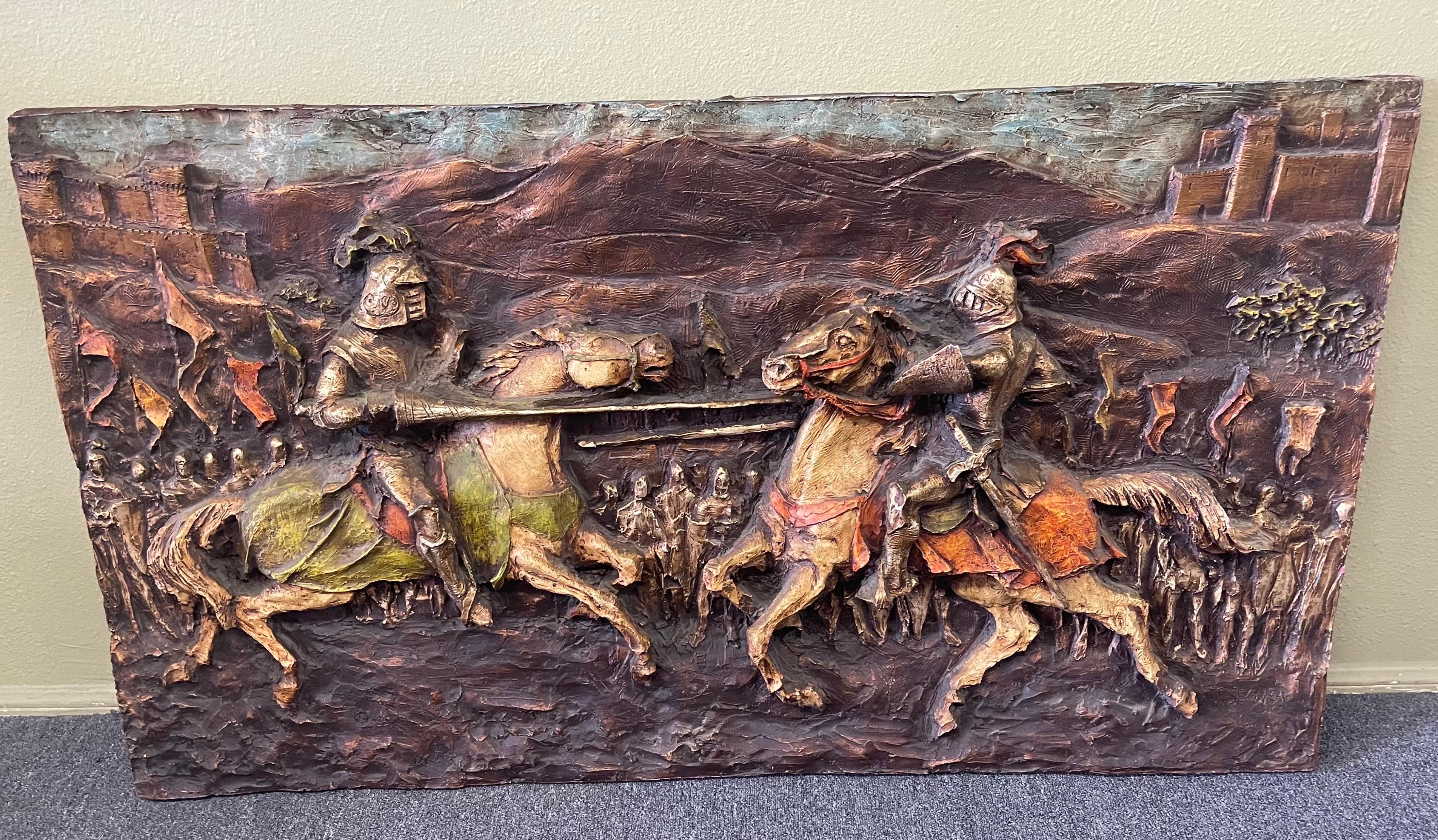 A modernist 3D figural wall sculpture / art of knights jousting by J. Segura for Segura Studios, circa 1965. Fiberglass construction with richly painted textured surface captures the knights and the landscape behind them. The rich brown background