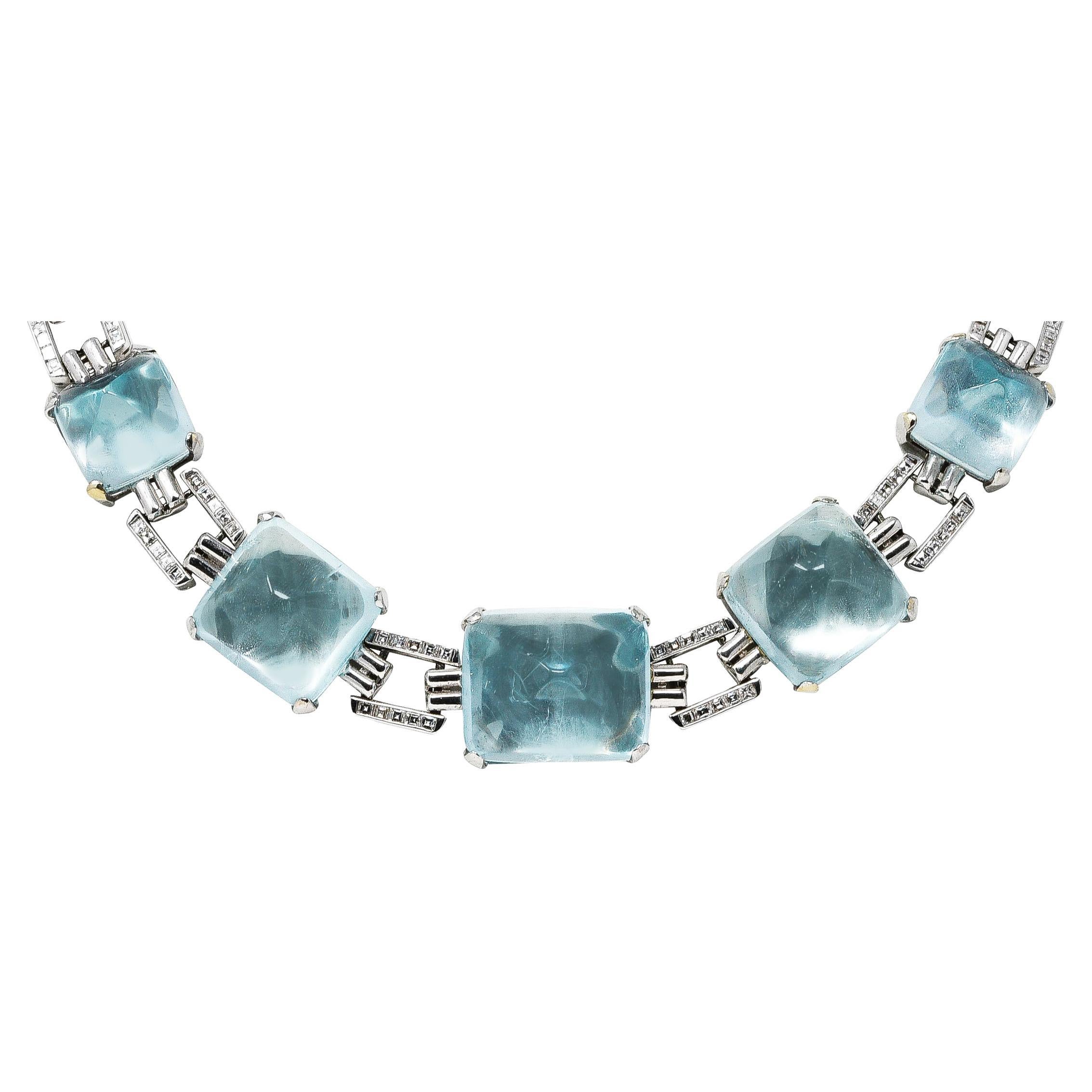 Designed as a panther link chain with sugar loaf shaped aquamarine cabochons weighing approximately 90.00 carats total. Transparent very light blue in color with natural inclusions - set in link stations with tab prongs. Alternating with rectangular