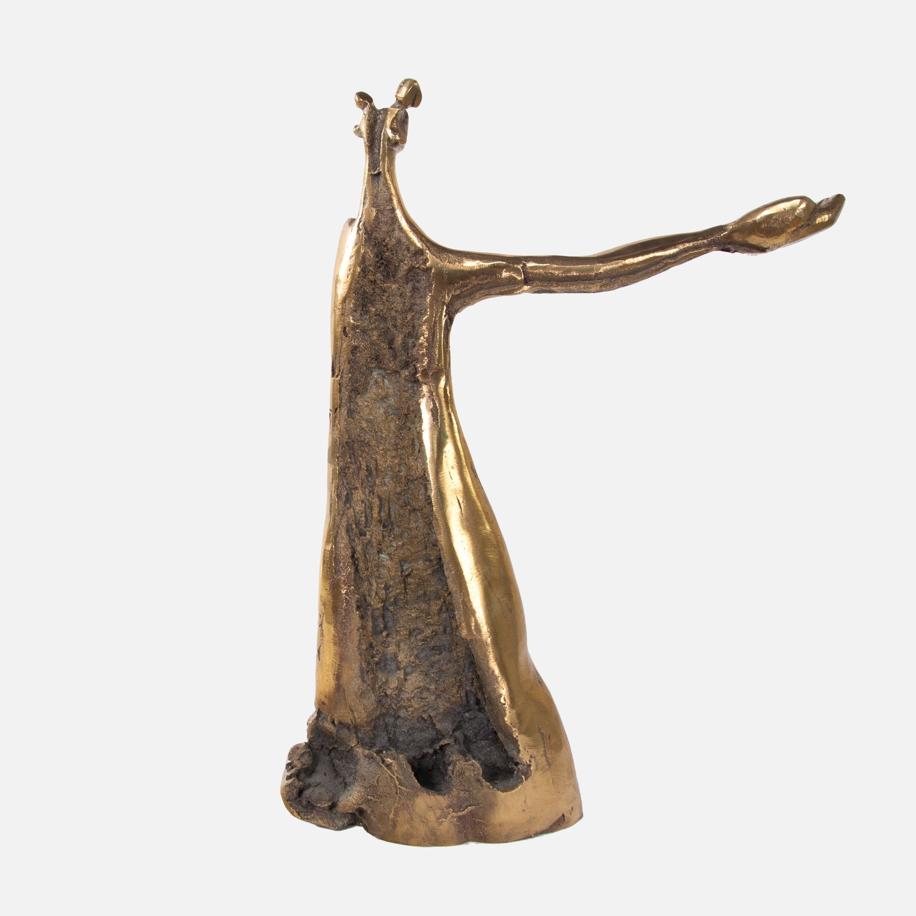 Abstract polished golden bronze sculpture of female depicted with sweeping lines and an outstretched charitable hand; The simple contours and the open lines enhance the simplicity; brightly polished; approximately 18.5