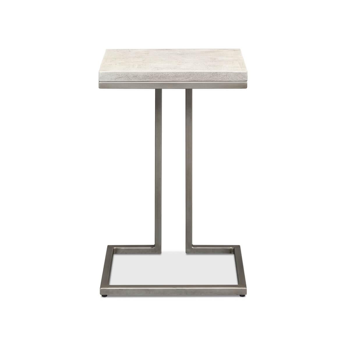 This piece features a compact, textured painted wood surface, presenting an earthy, grounded aesthetic. The streamlined, gunmetal iron base offers a contemporary contrast with its reflective finish and sharp angles.

Its small footprint makes it an