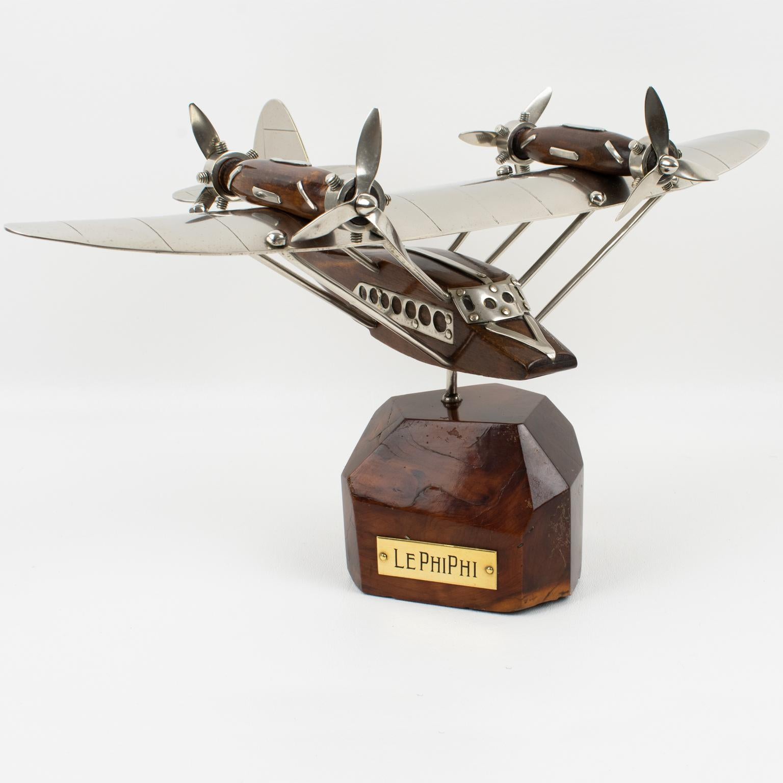 A fantastic French Art Deco chrome and wood airplane or seaplane model mounted on a stylized wood plinth. A superbly crafted rendering of the legendary quadri-propellers seaplane, strikingly evocative of a golden age in air travel. This handsome