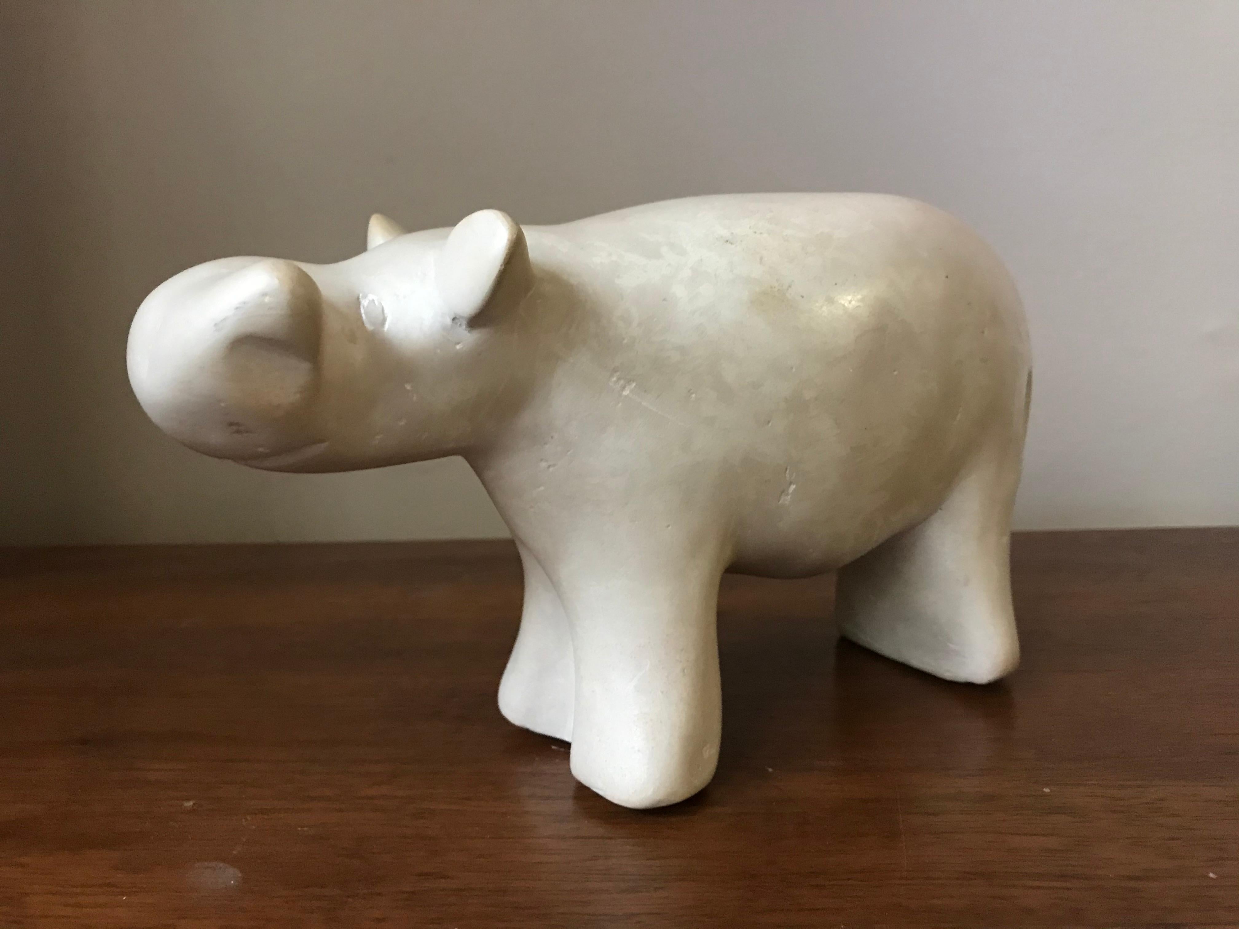 1950s-1960s modernist hippo sculpted from alabaster. Came from an artist's estate - everything was 1950s-1960s and most items were listed artists, besides her own work. This piece is unsigned. When set down, it slightly wobbles before coming to