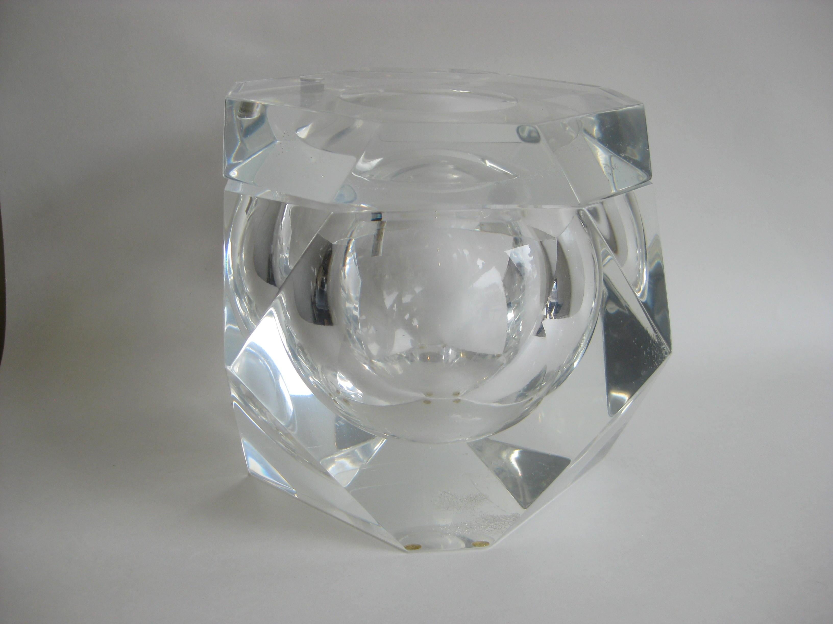 Fantastic Lucite faceted edge ice bucket designed by Alessandro Albrizzi, circa 1970. Top swivels as it should. Outstanding form and design. In very nice original condition. No chips or cracks. Light surface wear on the bottom as expected from age.