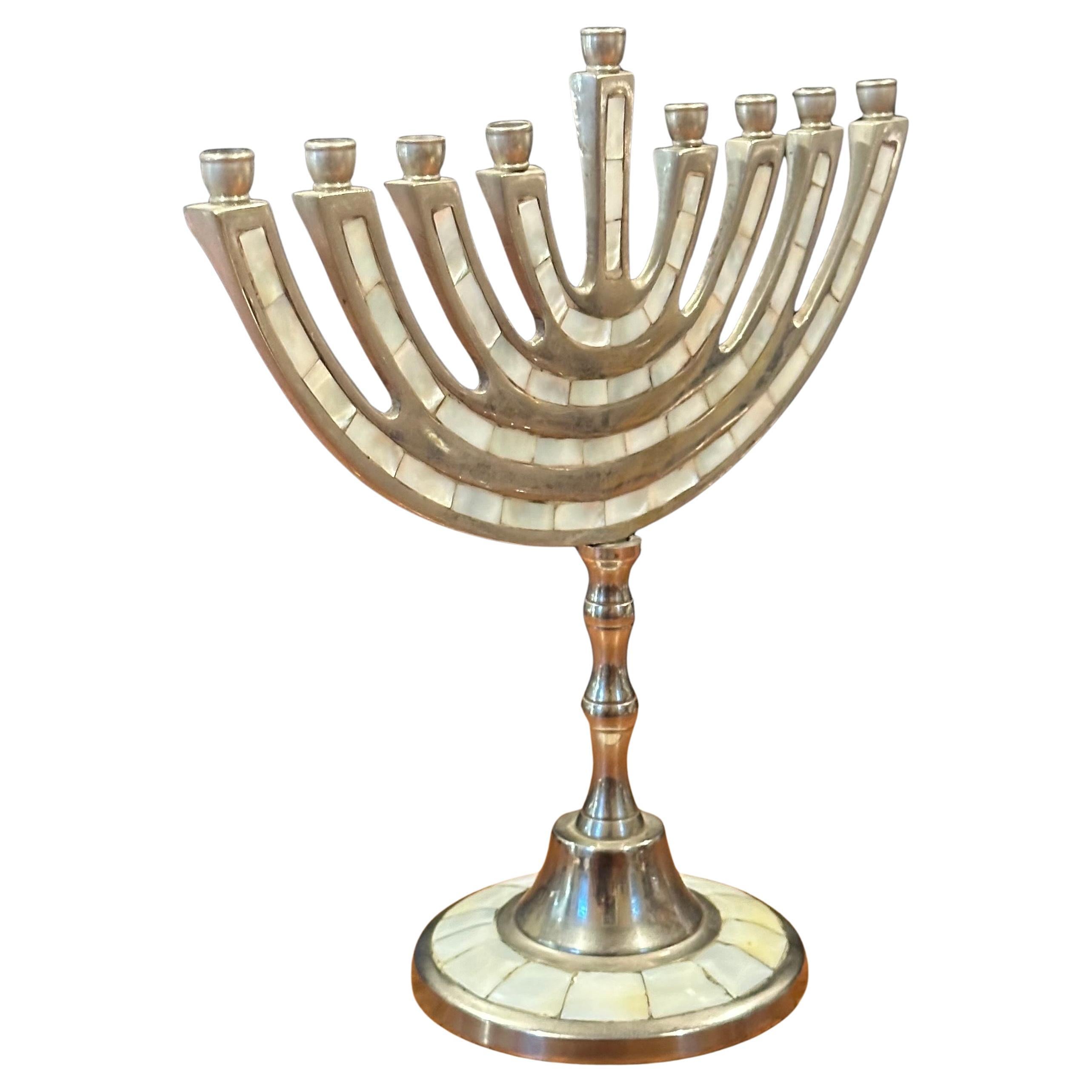 Modernist aluminum and mother-of-pearl menorah, circa 1970s. The menorah is in very good vintage condition and measures 9.25