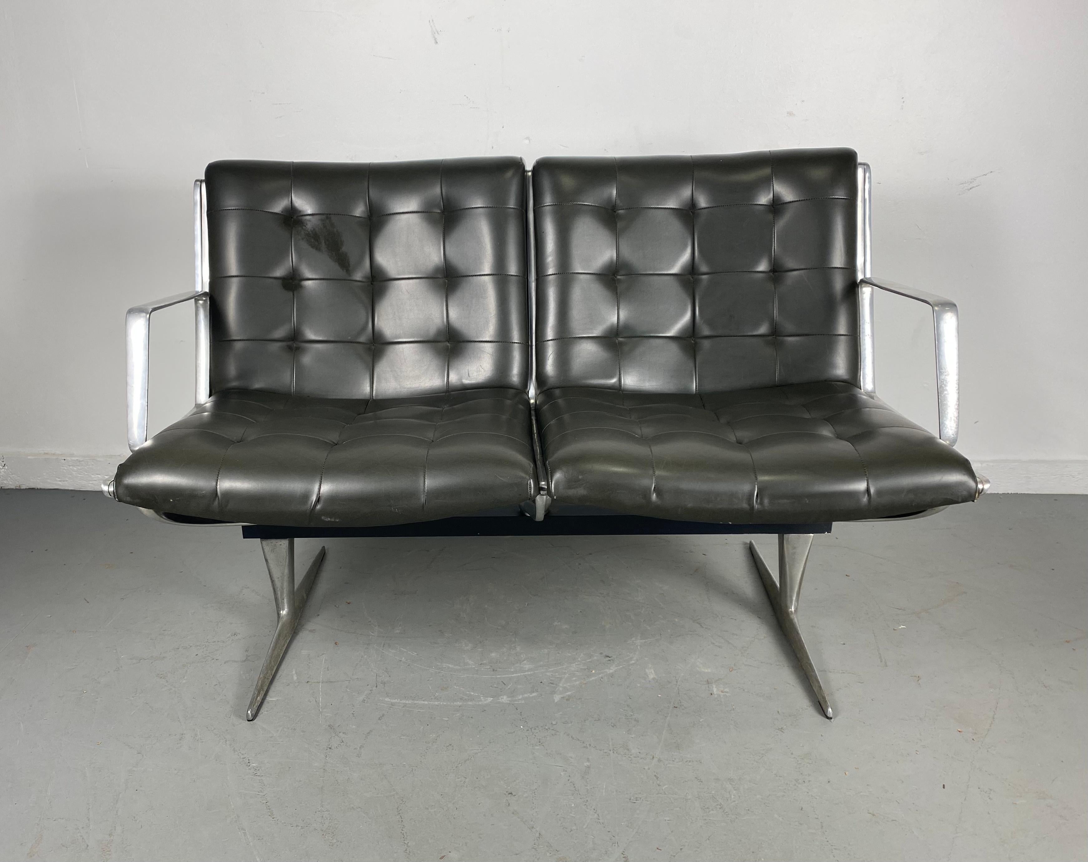 Modernist aluminum button tufted two seater bench / settee by Burke,, Seldom seen settee,, cast aluminum frame,, steel green naugahyde upholstery, Extremely comfortable,,super stylish,, superior quality and construction,,Retains original BURKE
