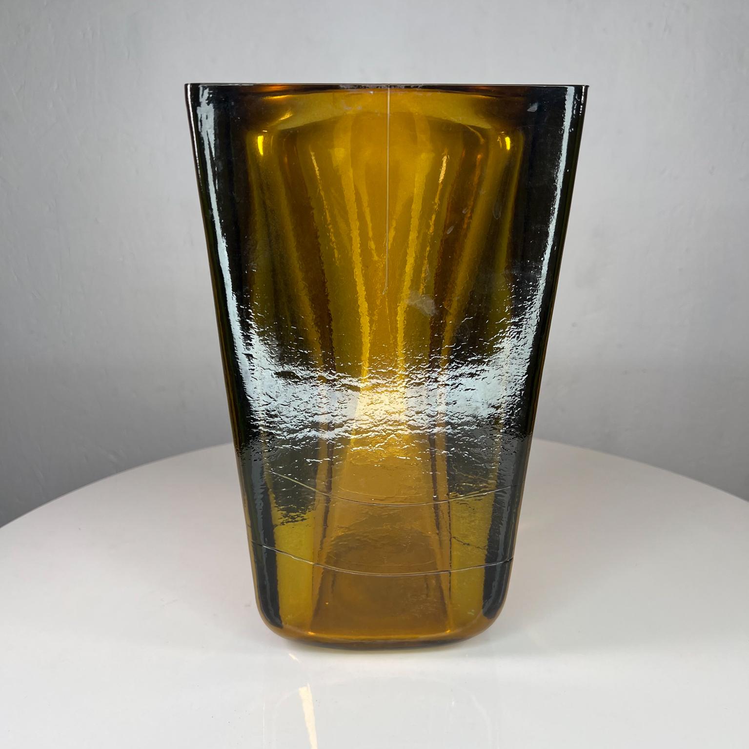 Modernist Amber Art Glass vase Style of Blenko
Thick glass panels
Unsigned attributed to Blenko Glass Co
11 tall x 6.38 x 6.38
Preowned original vintage condition
See images provided.