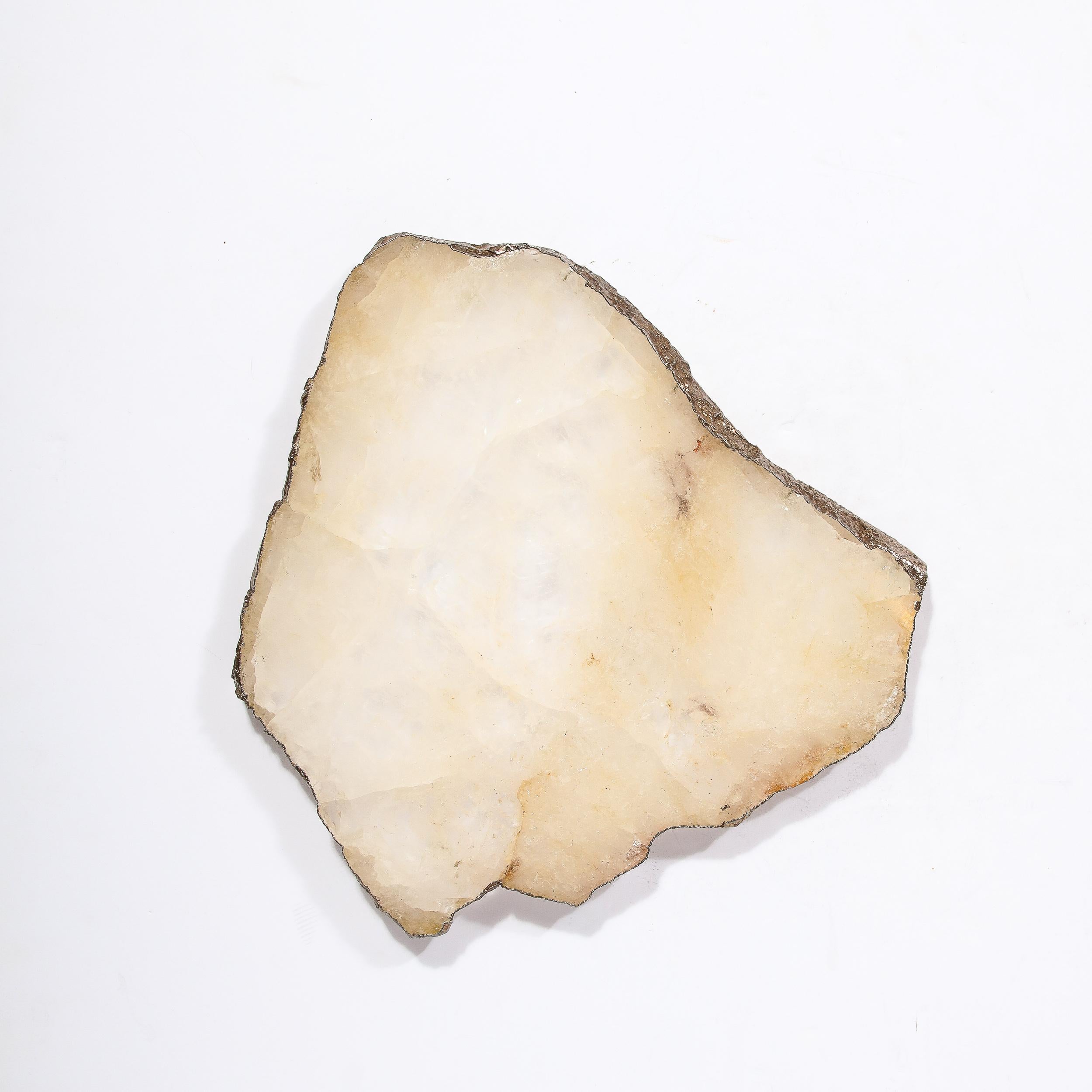 This elegant modernist tray features a beautiful slab of crystal quartz geode in a warm honeyed off white hue- exhibiting the natural beauty of the stone- full of tonal variation and rich veining. This natural material- a work of art in its own
