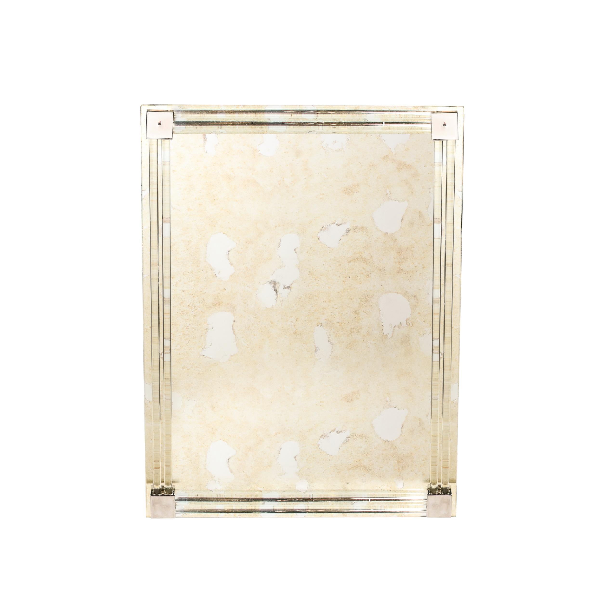 This lovely yet powerful Mid-Century Modernist Mirror originates from the United States during the latter half of the 20th Century. Featuring corners capped in rectangular nickel elements joining together the stunning glass rods circumscribing the