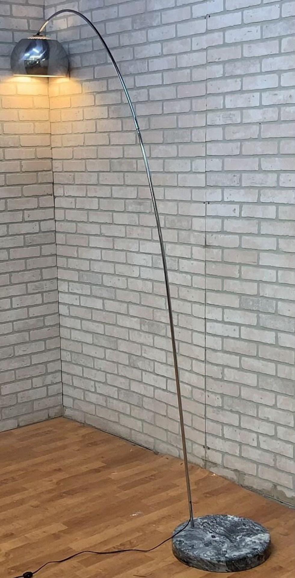 Modernist Arc Lamp with Marble Base 

Brushed metal arc lamp with solid marble base. Lamp turns on and off with plug in step switch.

Circa 21st Century 

Dimensions 
H 87