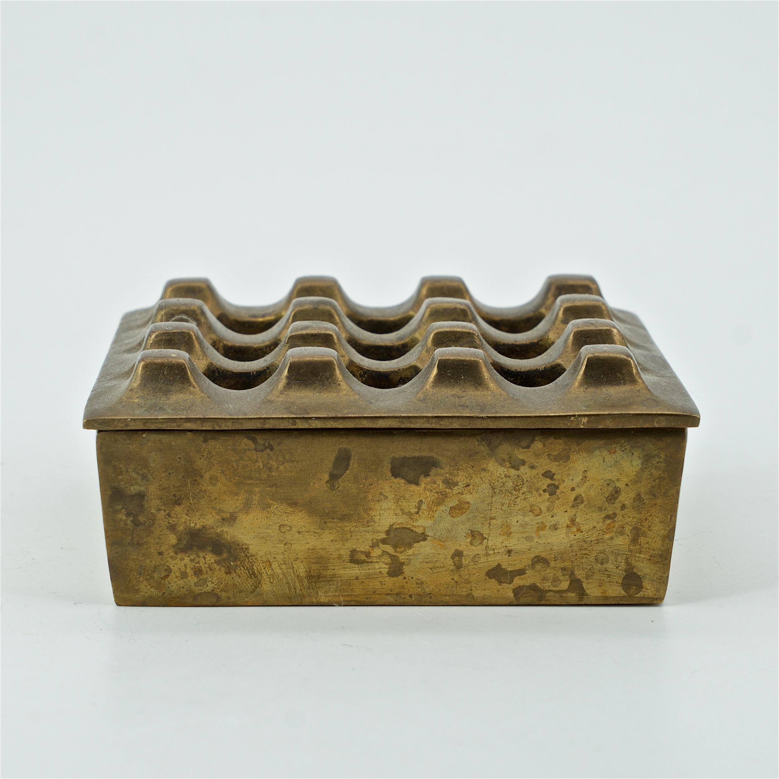 Fun tabletop decor. A vented metal stash box or ashtray, egg crate textured lid. No makers markings.