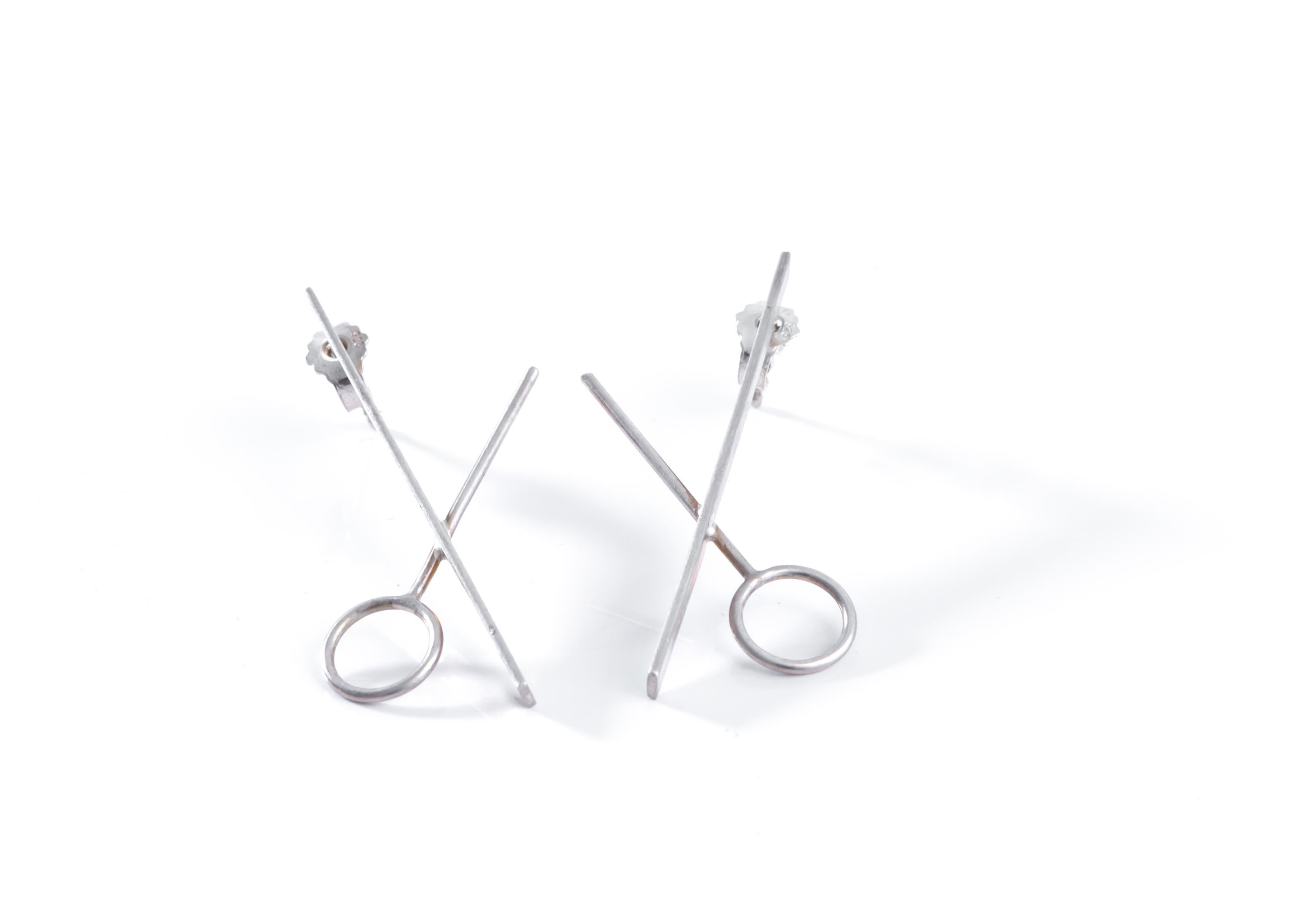 Minimalist, subtle and chic pair silver stud earrings. Designed and custom made in 2011, by silversmith Aron Irving Li. Both earrings are in excellent condition. 