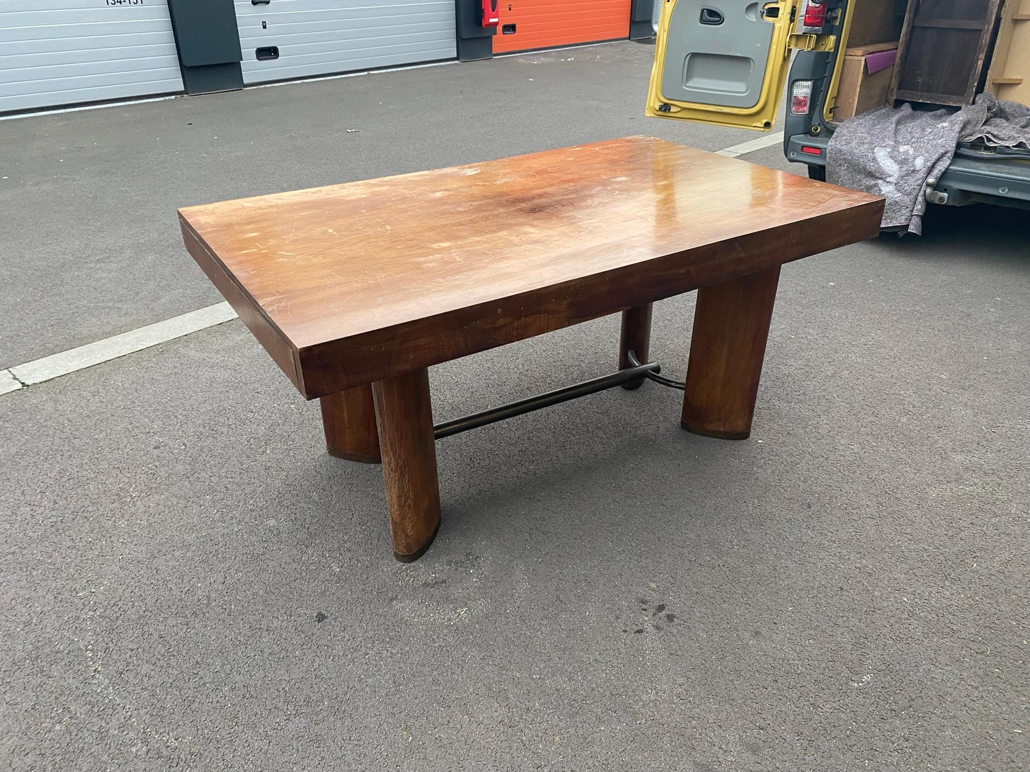 modernist Art Deco desk or table in walnut, metal spacer and shoe, circa 1930 
varnish to redo.
 